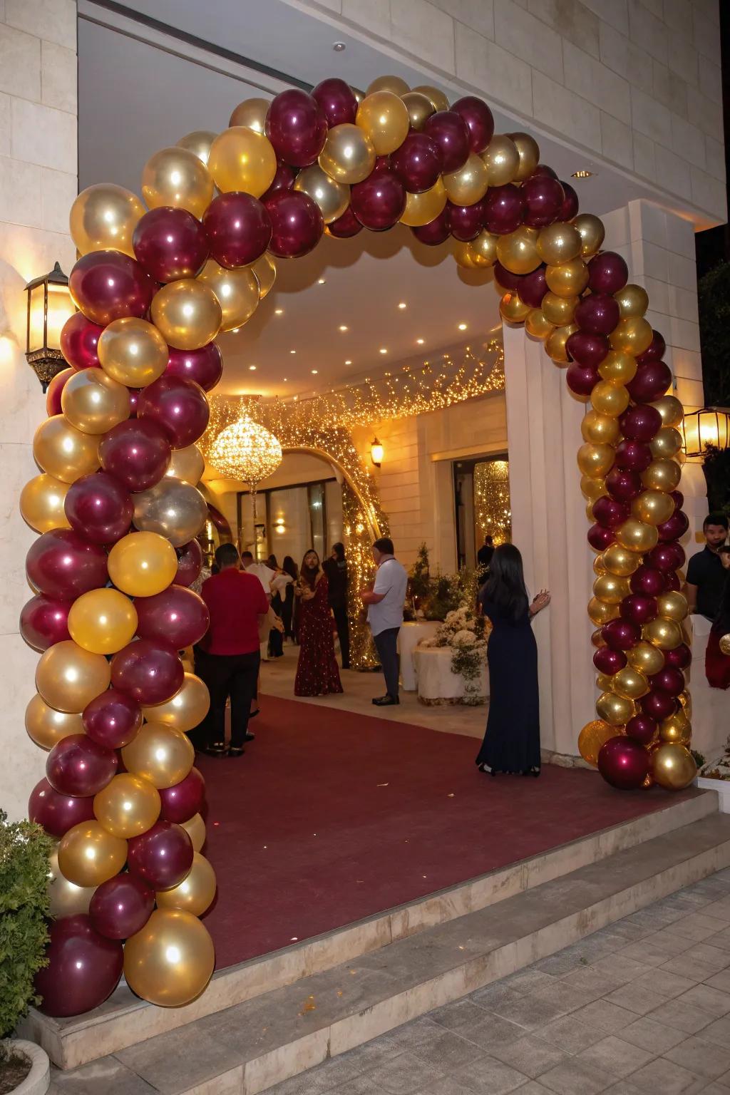 A breathtaking red and gold balloon arch elegantly welcomes your guests.