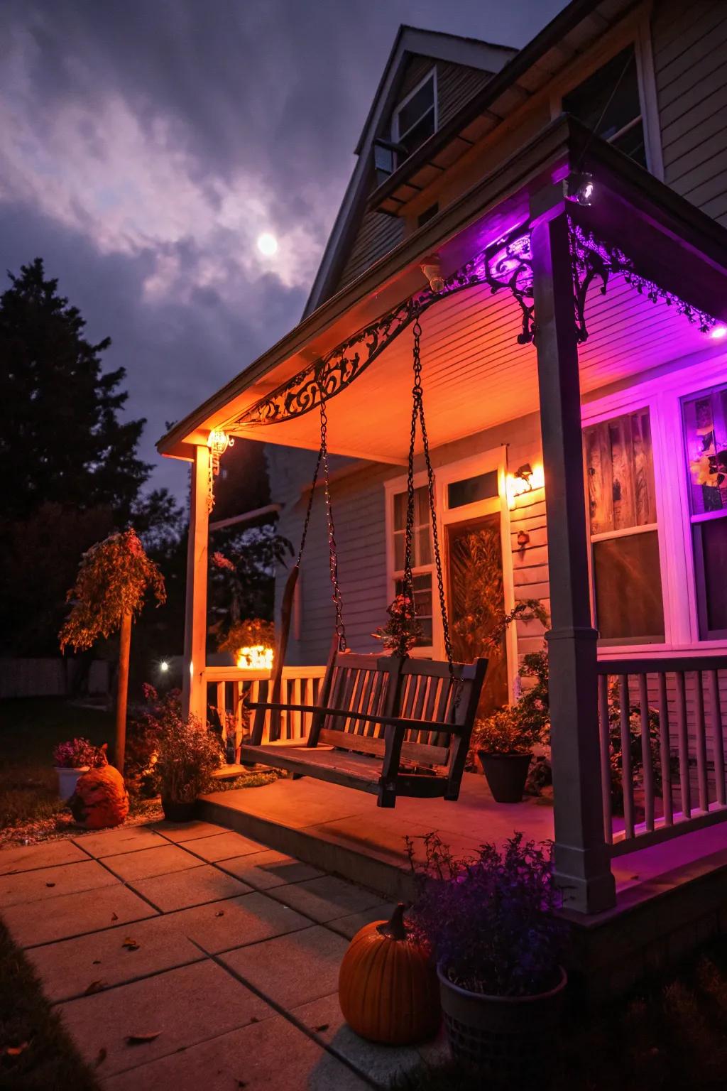 Tangerine and lavender lights lay the foundation for a spooky porch.