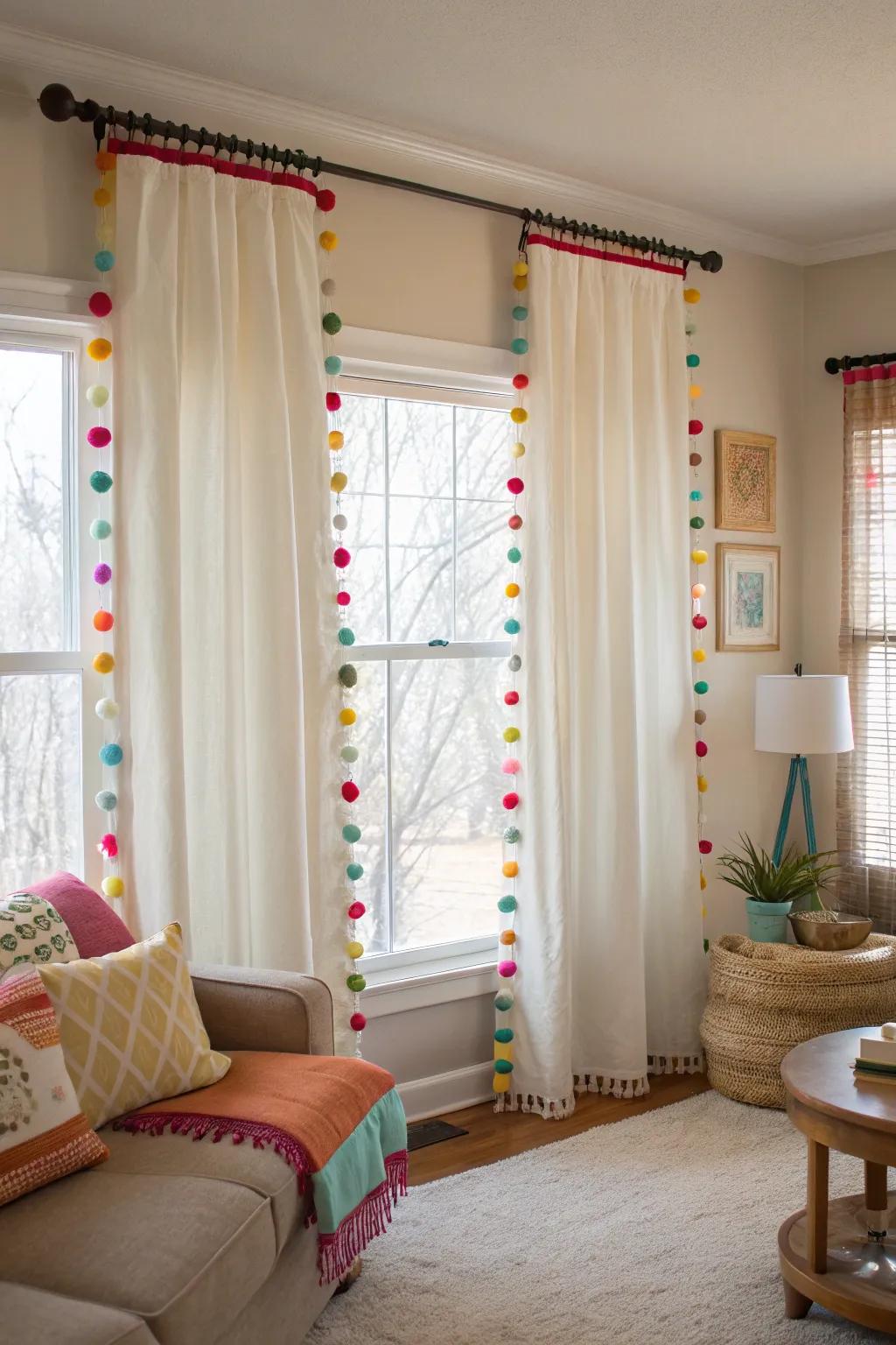 Living room curtains enhanced with playful pom pom trims.