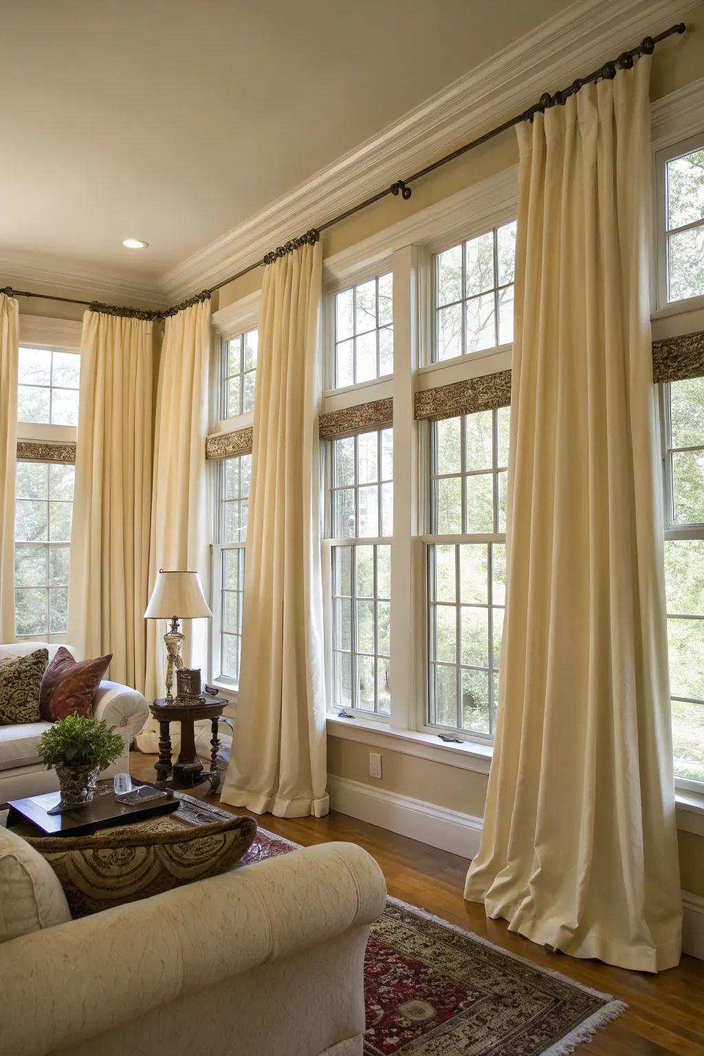 Coordinated drapes bring a sense of unity and sophistication to a room with several windows.
