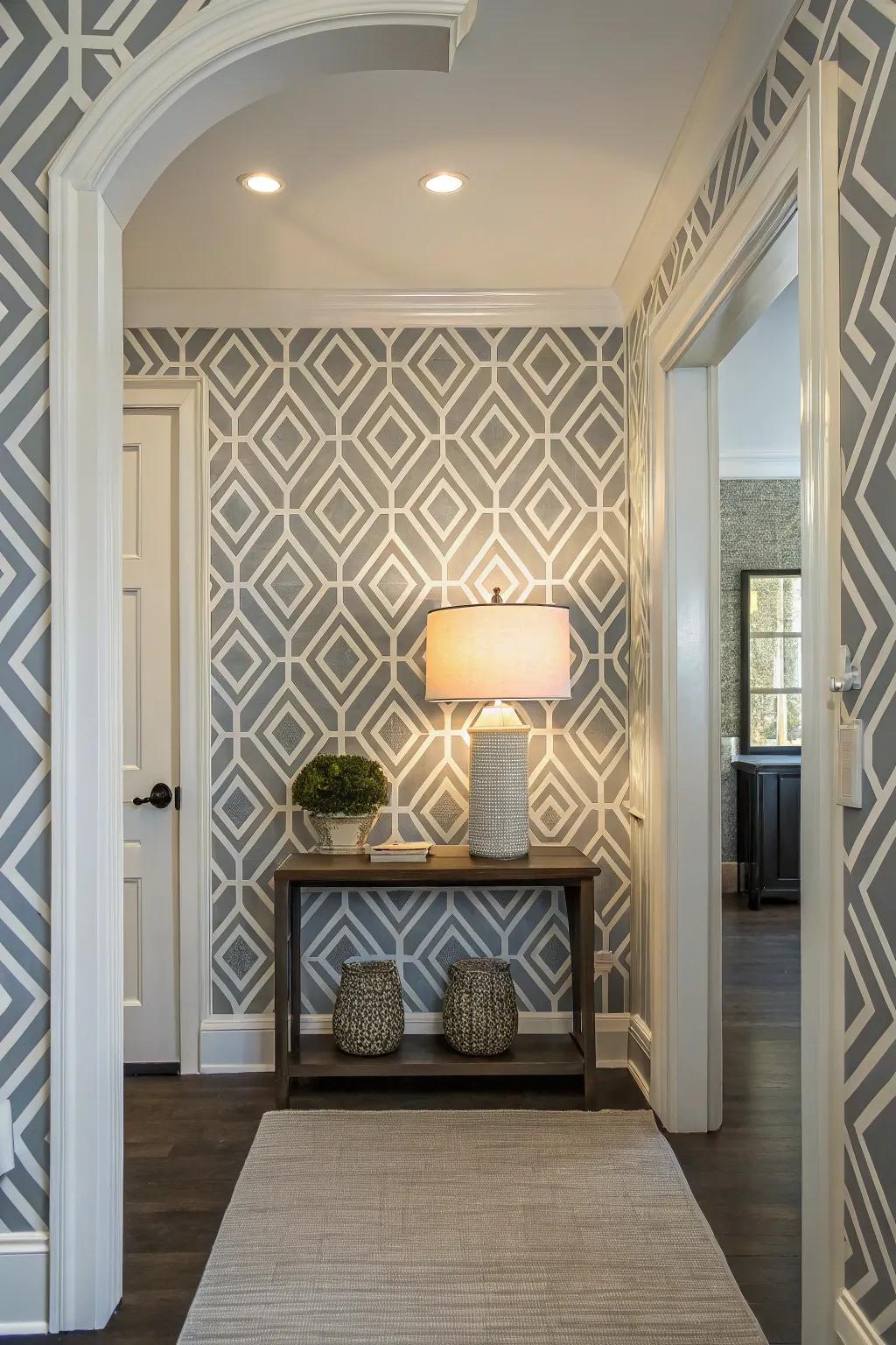 Contemporary entryway featuring geometric wallpaper for a modern atmosphere.