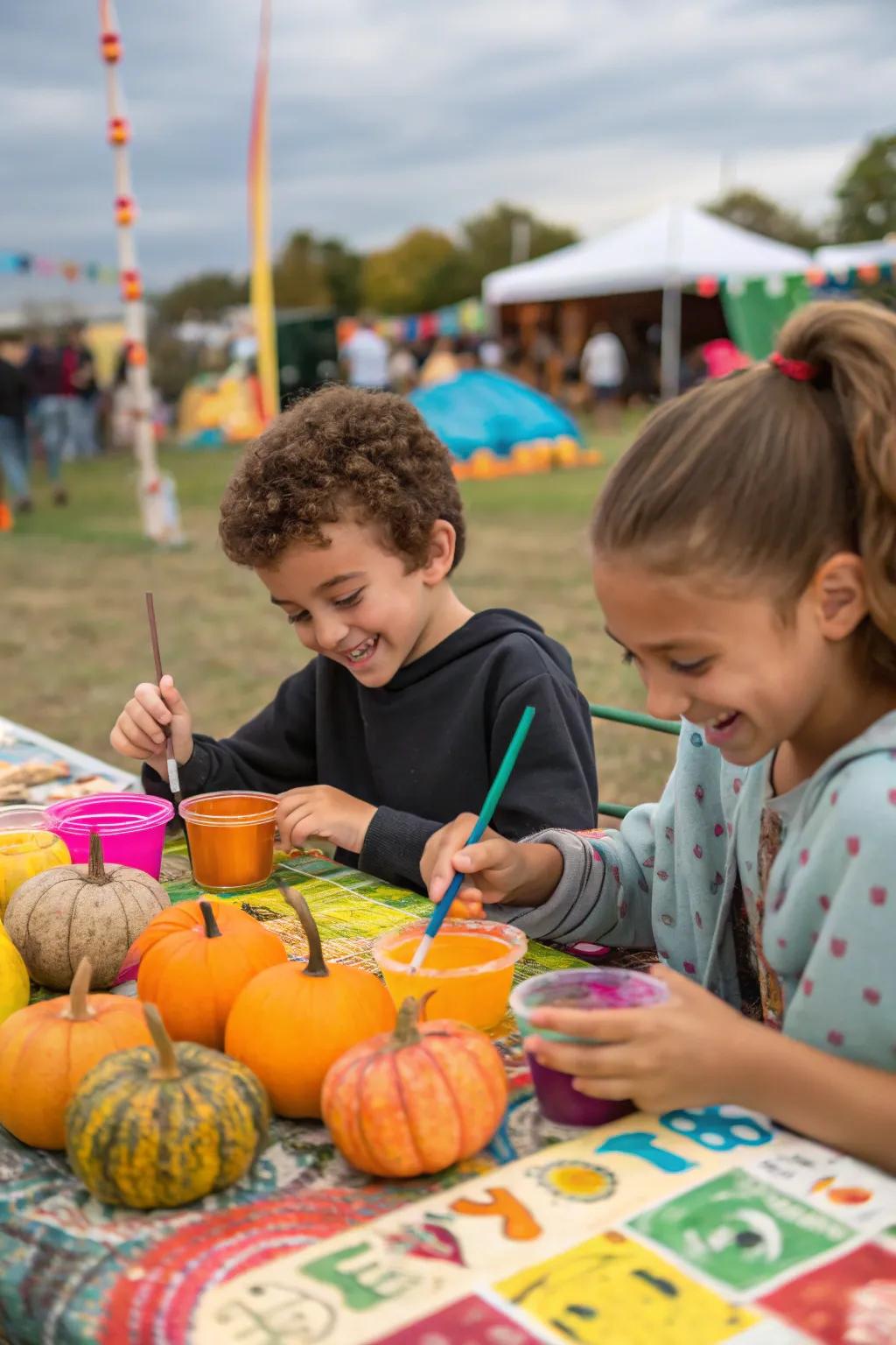 Children having fun at a gourd painting spot during the fall festival