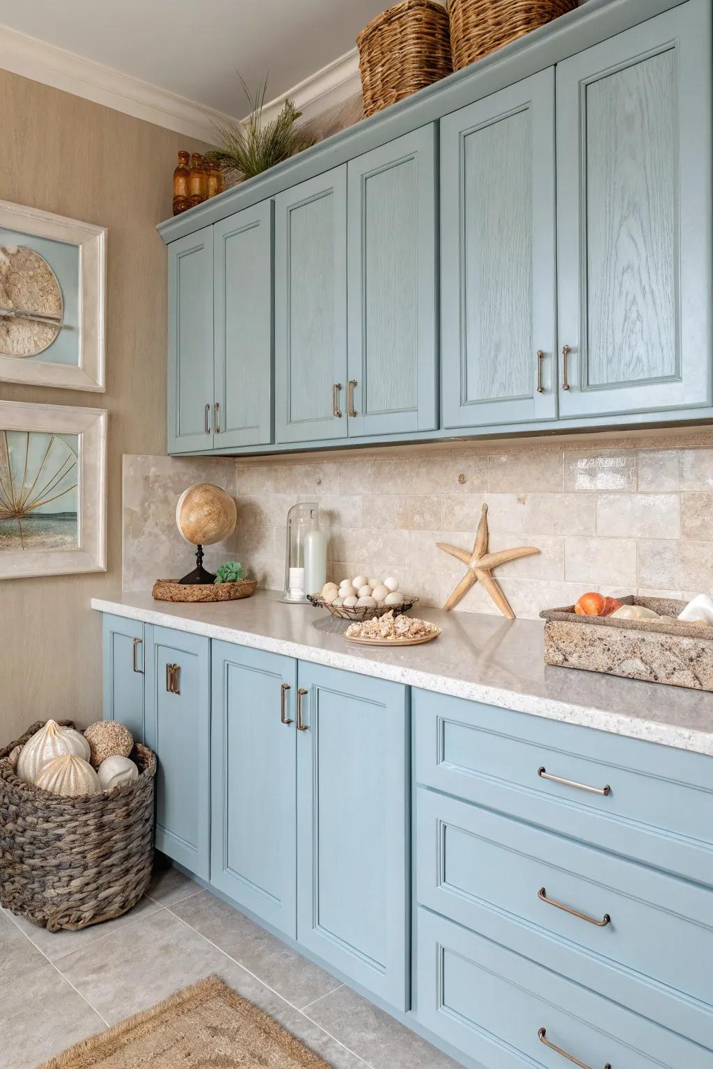A kitchen that draws inspiration from coastal colors, showcasing delicate blues and sandy neutrals.