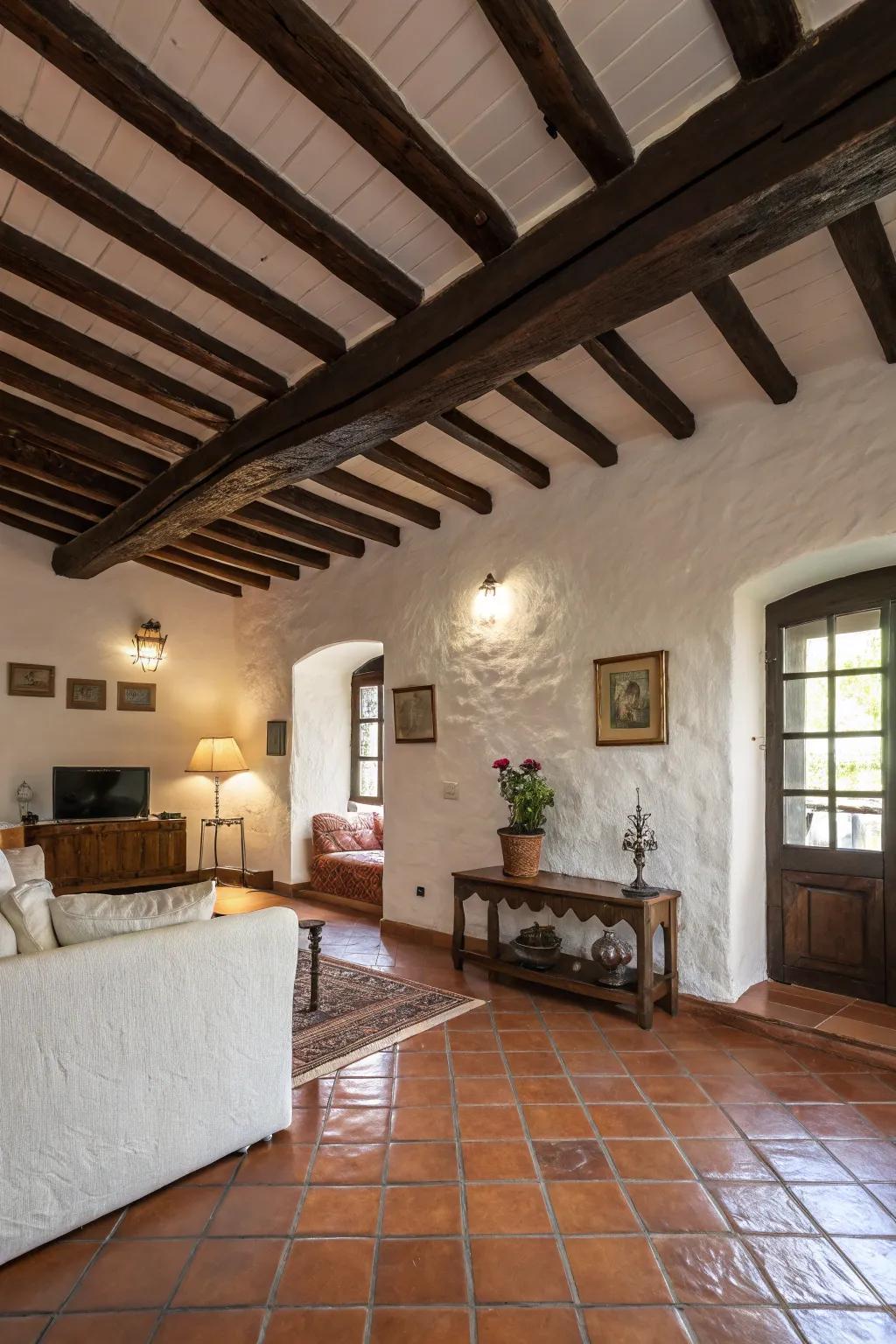 Exposed wooden beams lend a rustic allure to this Spanish-inspired living space.