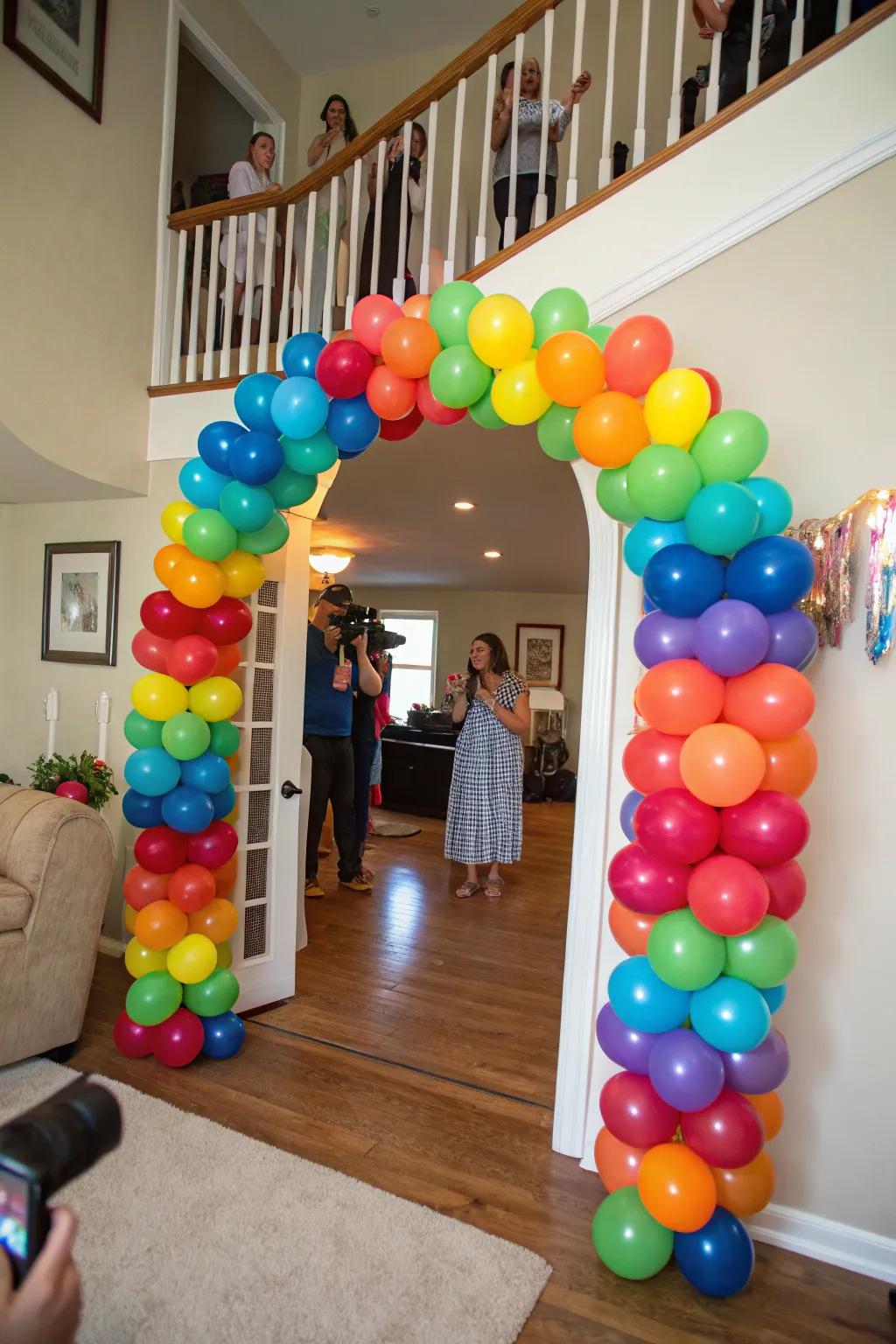A bright balloon arch providing a festive welcome at the graduation celebration.