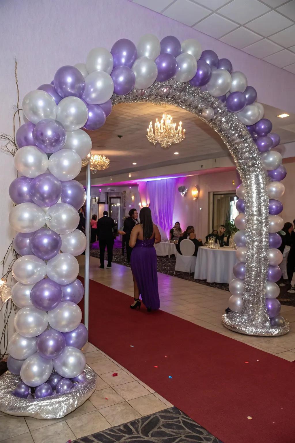 A captivating entryway enhanced by a lavender and silver balloon arch, warmly welcoming guests.