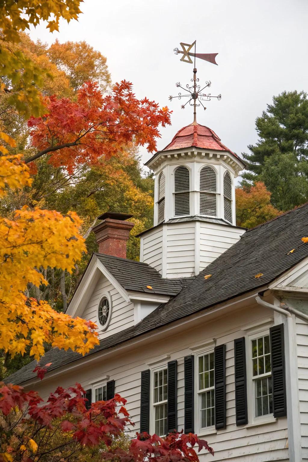 A distinguished Colonial home accentuated by a wooden cupola and traditional weather vane.