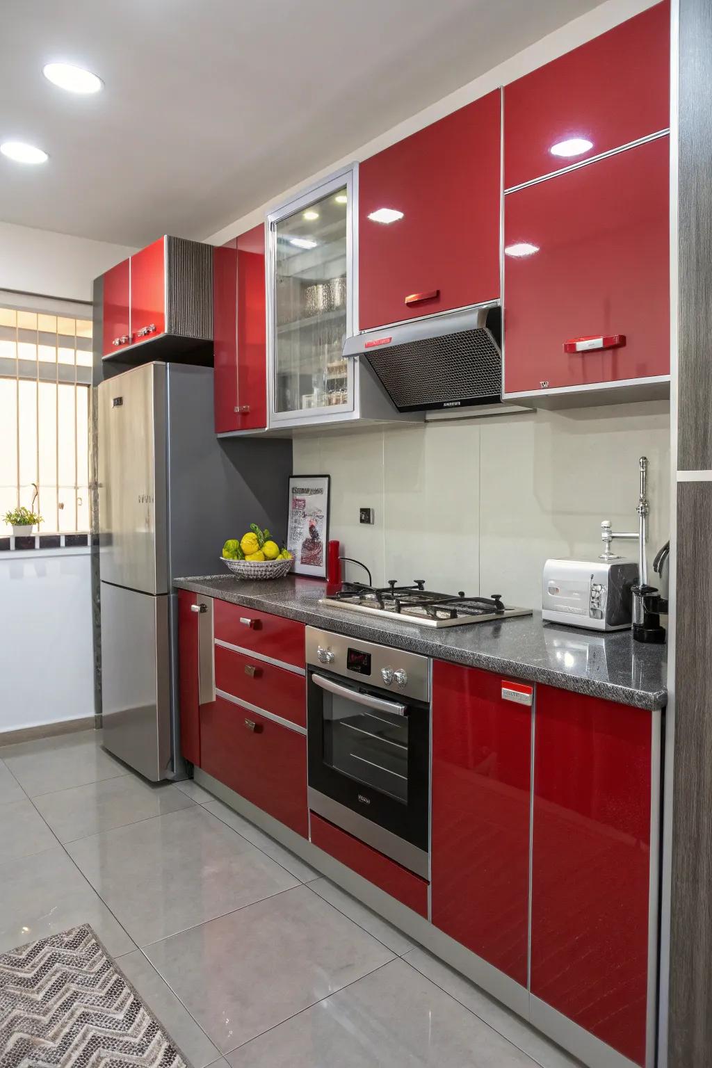 Shiny red and gray cupboards reflecting light, ideal for smaller kitchens.
