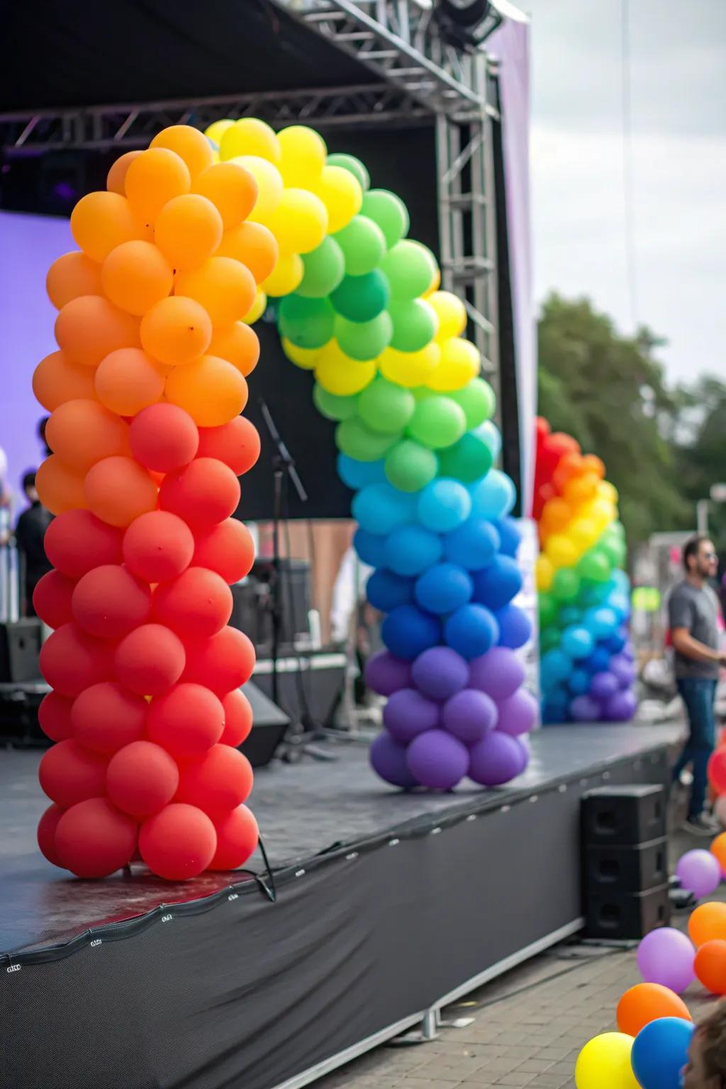 A stage showcasing a rainbow-themed balloon decoration arrangement.
