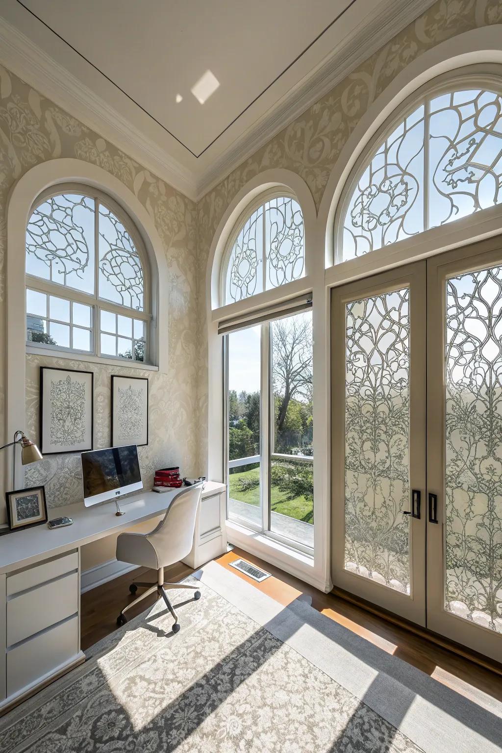Contemporary home office with decorative film on arched windows.
