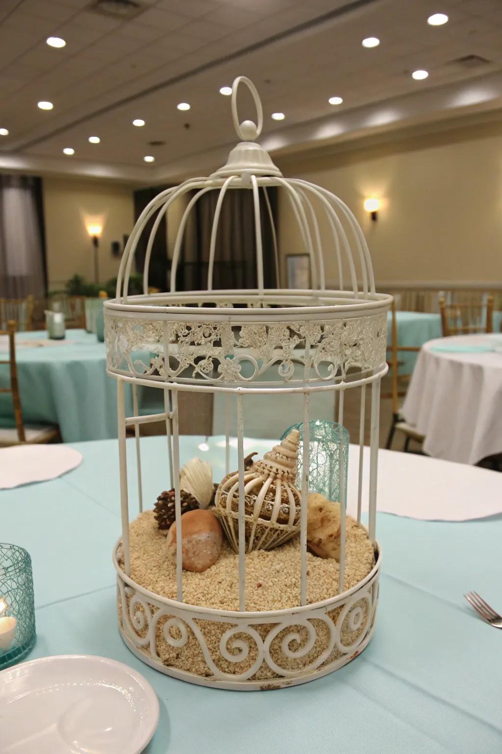 A coastal-themed bird cage centerpiece presenting beachy components.