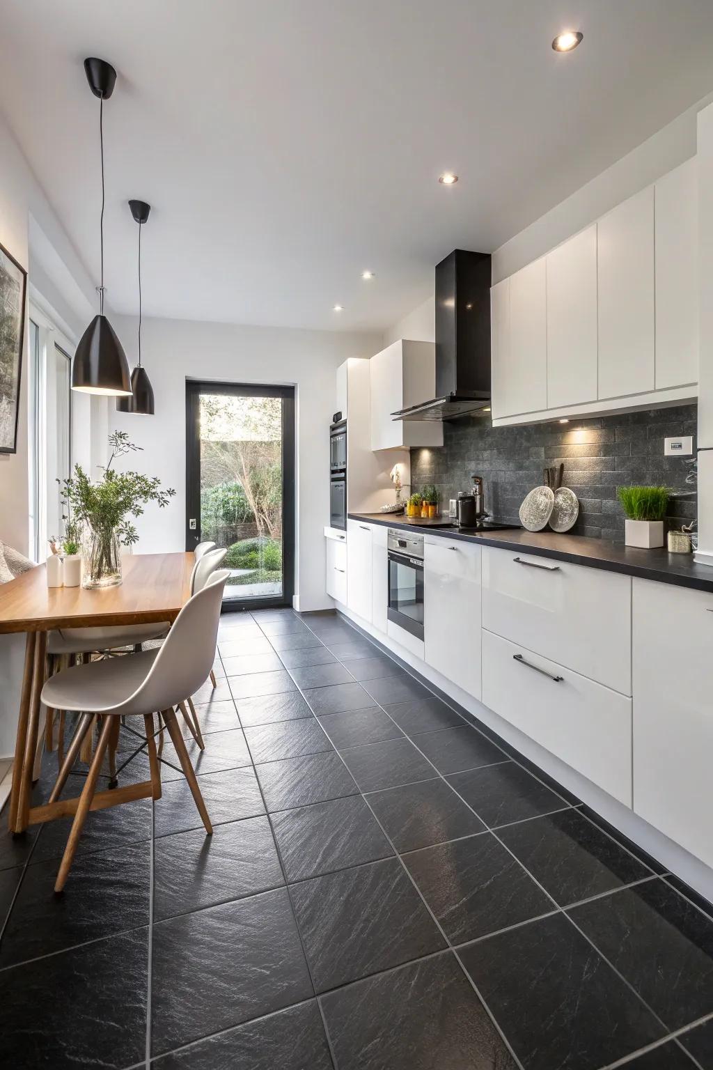 A kitchen that pairs black floors with white items.