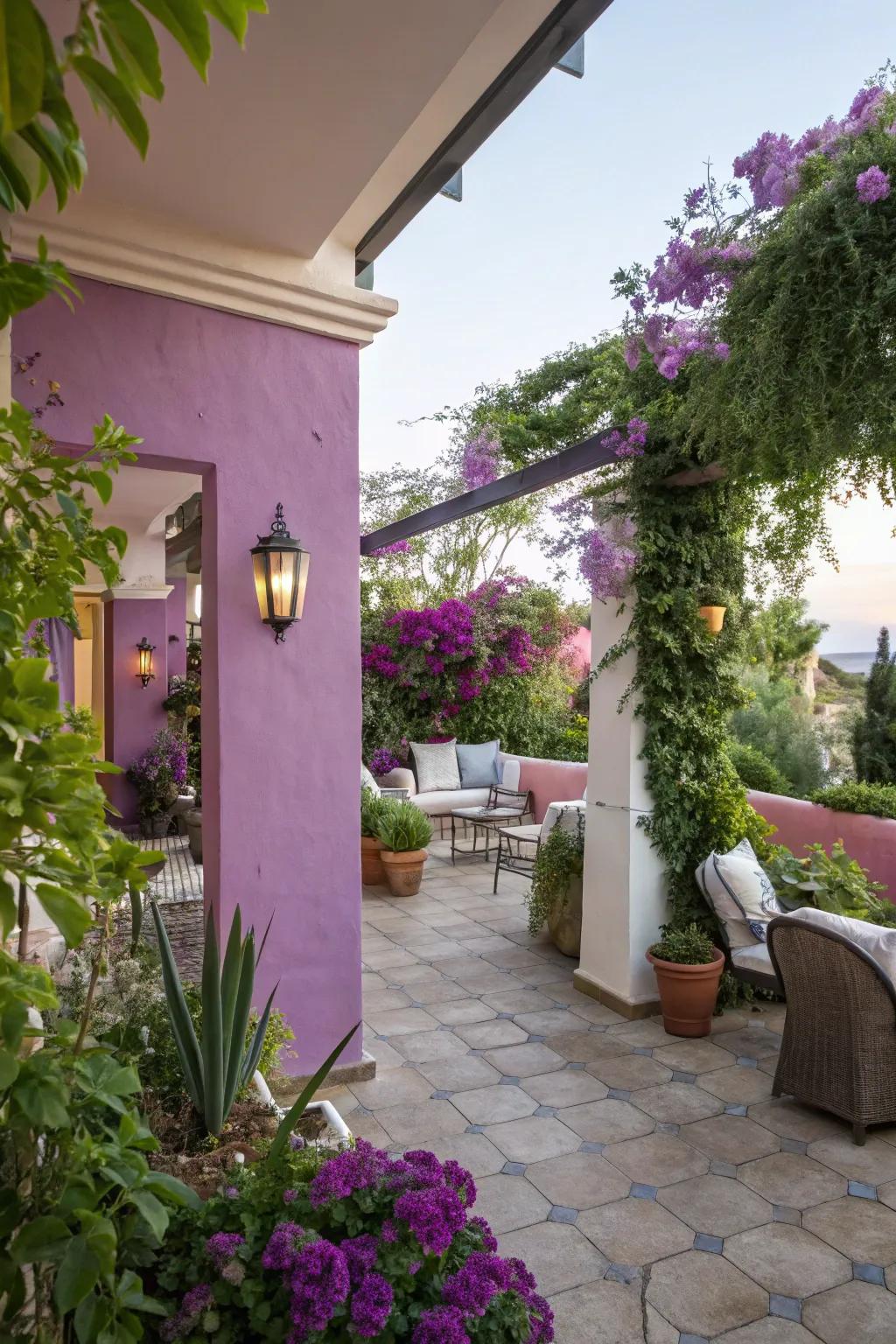 An outdoor patio enhanced by soft purple walls and lush greenery.