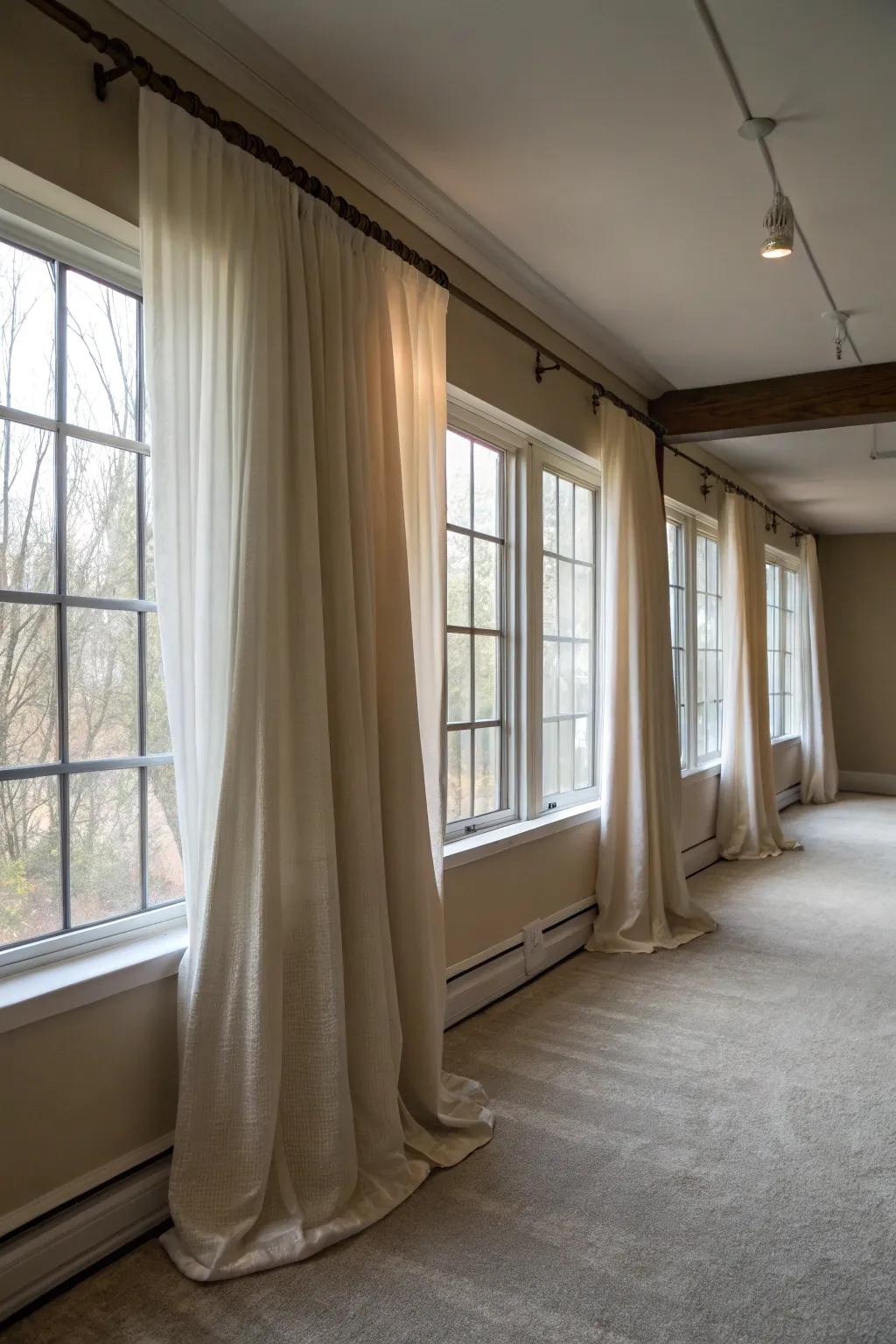 Hanging curtains strategically creates the illusion of larger windows.