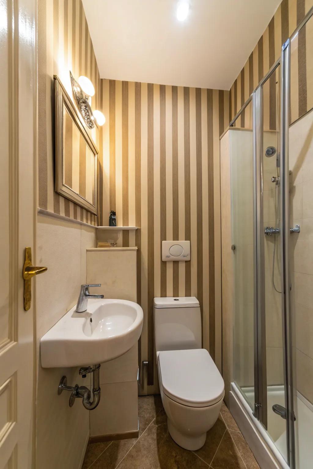 Vertical stripes add height to this small bathroom.