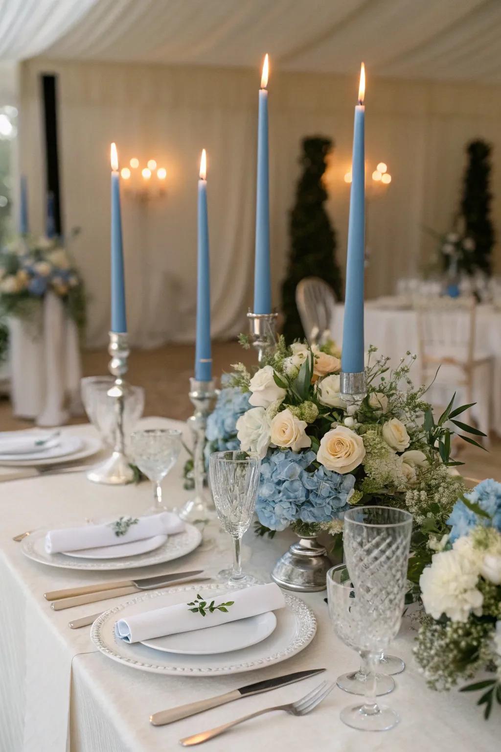 Blue thin candles add a romantic glow to the tablescape.