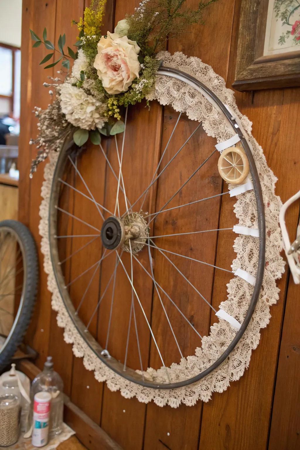 A vintage bicycle wheel wreath with lace and trinkets for a nostalgic charm.