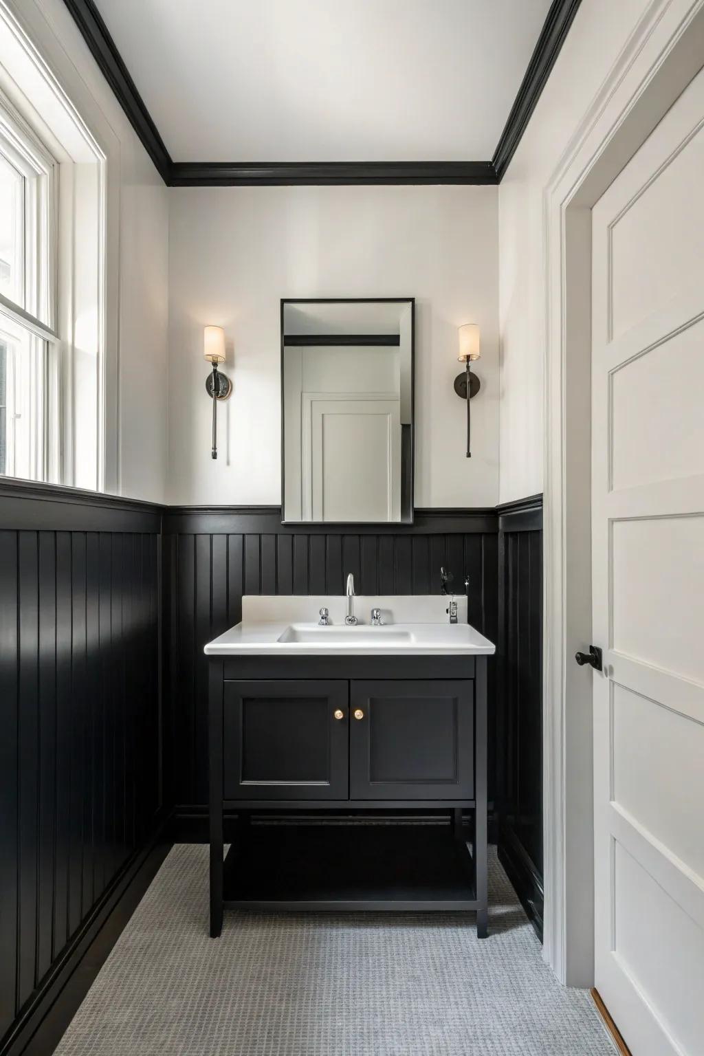 A modern minimalist bathroom featuring sleek black wainscoting.