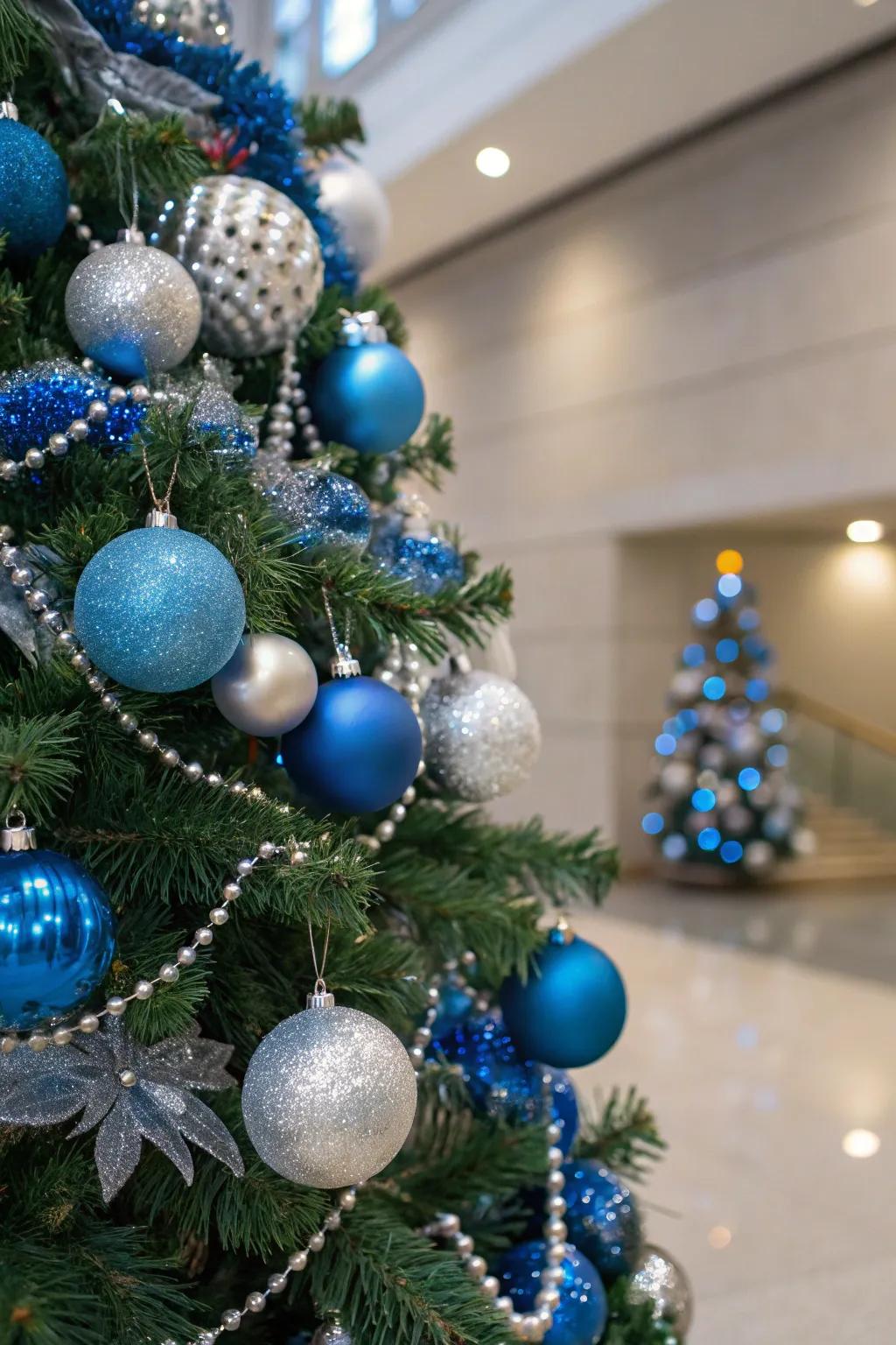 A stunning solitary-pigment themed Christmas tree exhibiting azure and argent decorations.