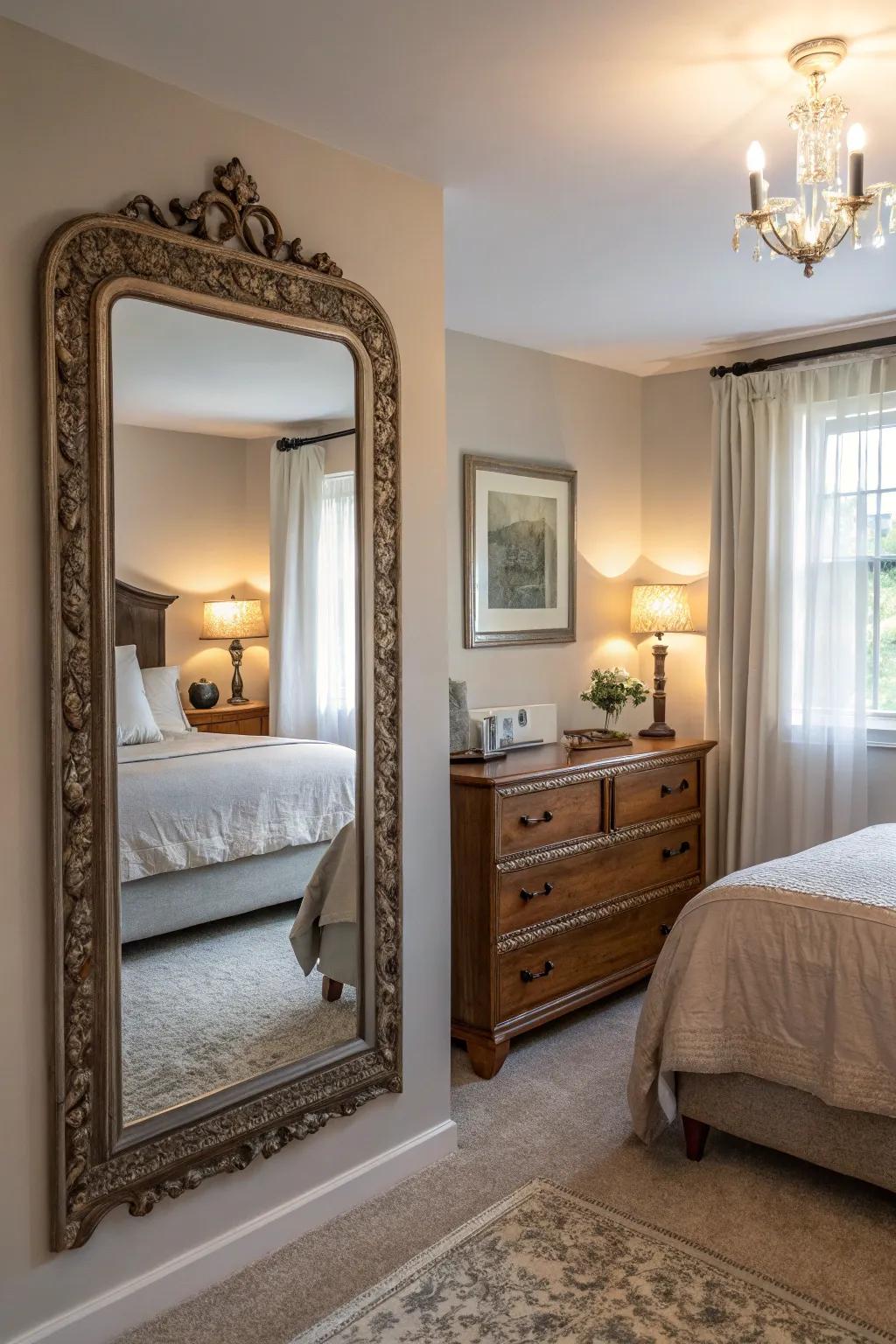 A vintage mirror enhances light and space in this farmhouse guest bedroom.