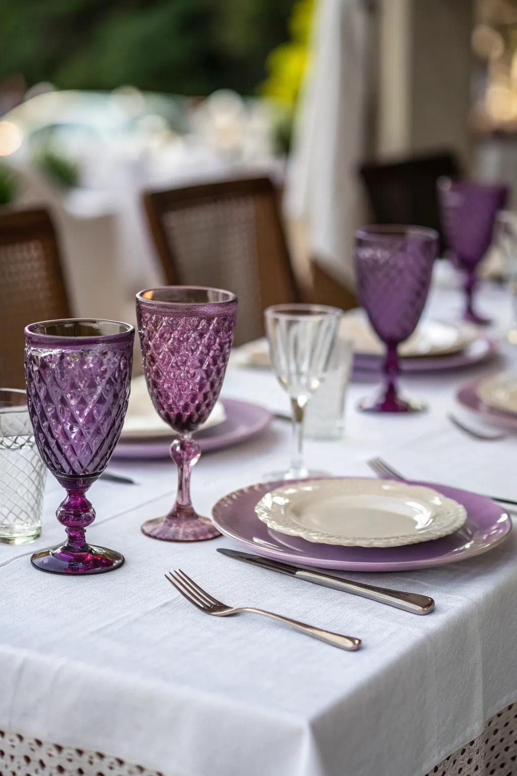 Violet tinted glassware appends a whimsical detail to any table setting.