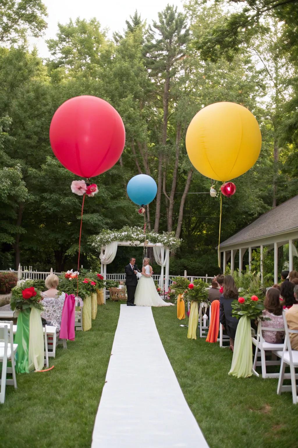 A garden wedding decorated with oversized rainbow-colored spheres.