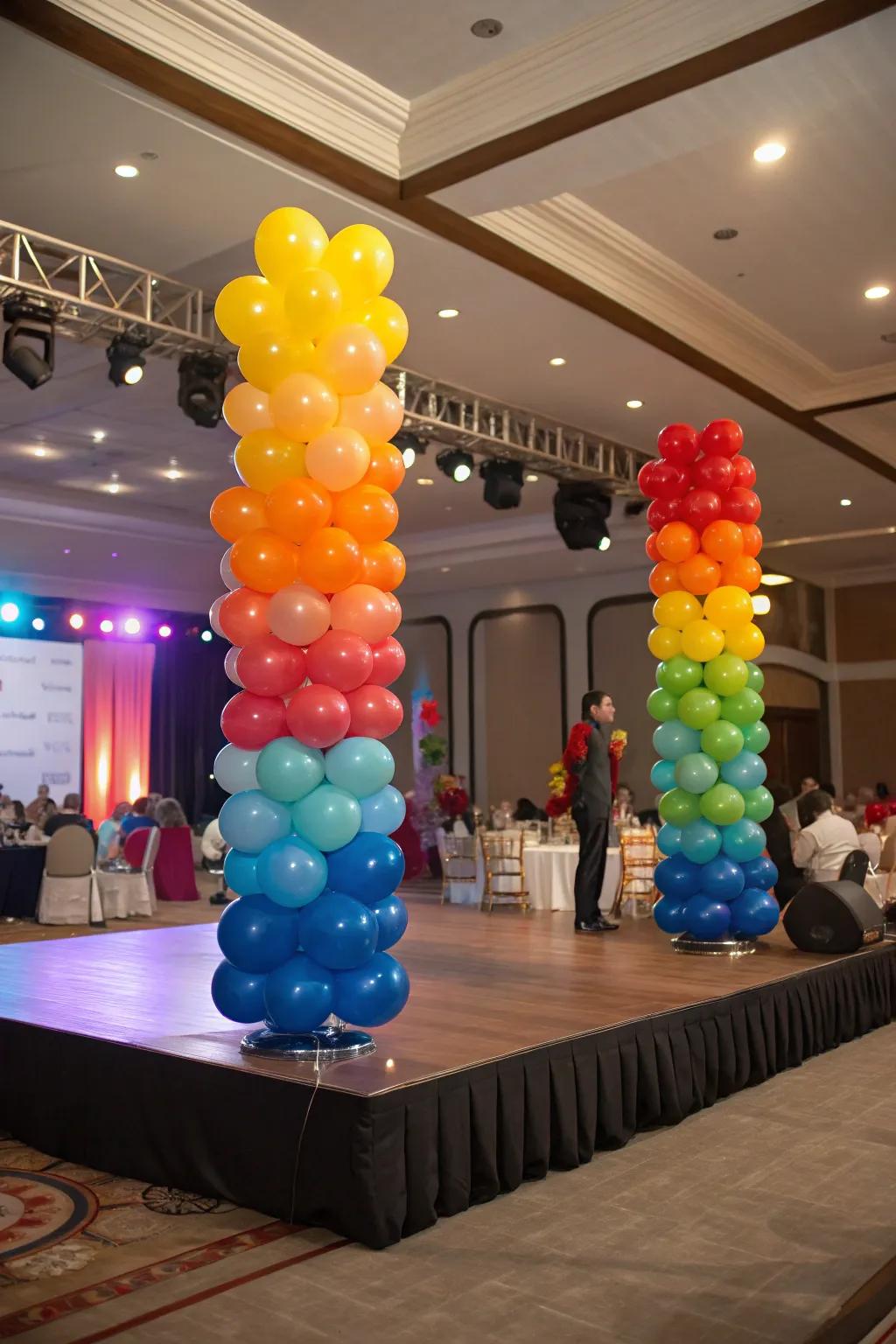 Balloon centerpieces adding elegance to stage tables.