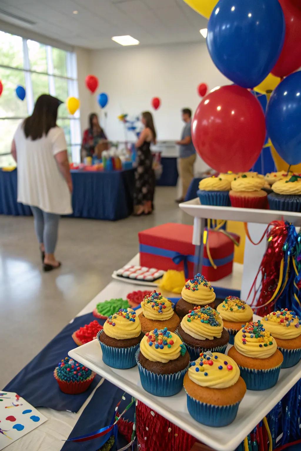 A dessert showcase with themed cupcakes provides a tasty treat and decor.