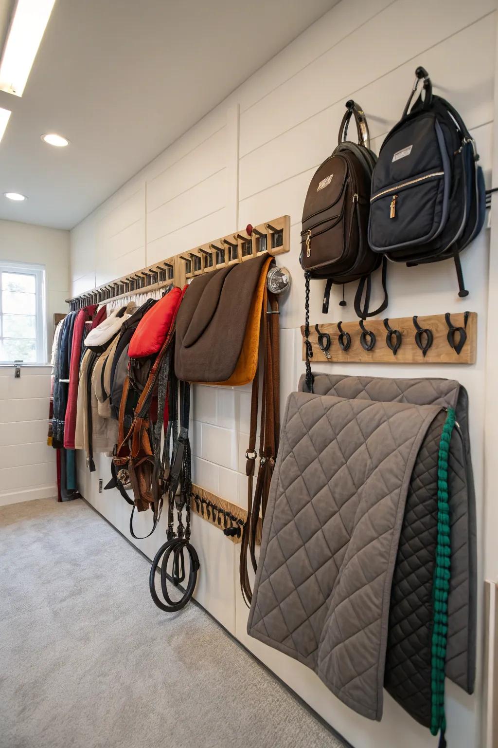 Wall-mounted blanket holders for efficient storage in a tack room.