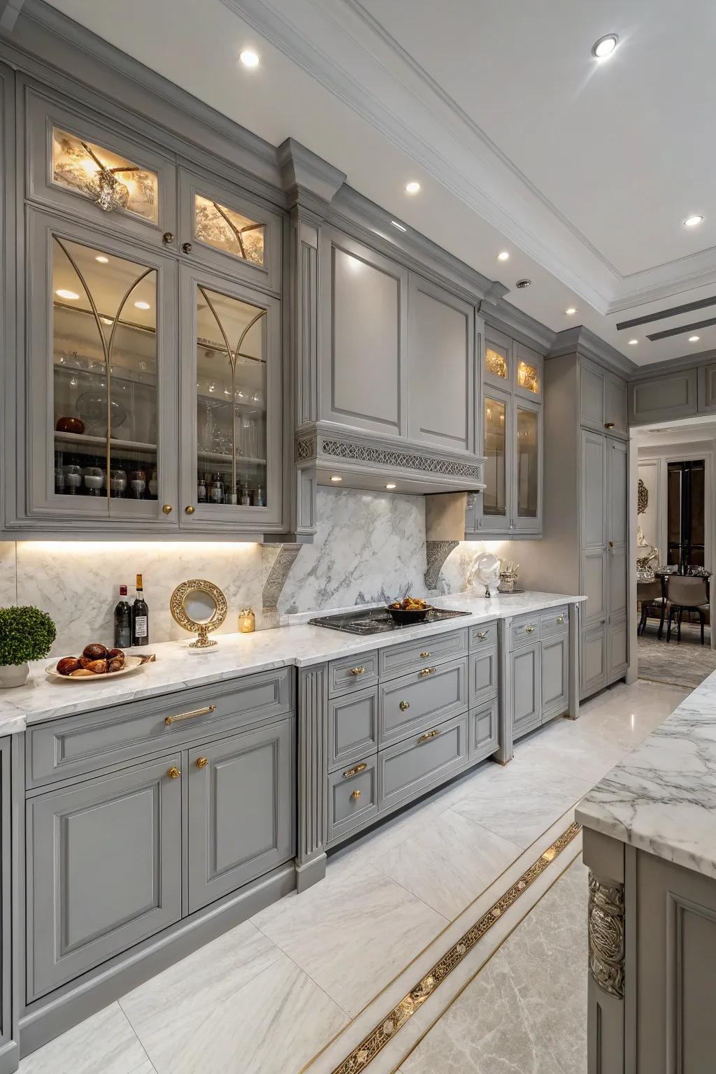 Stone worktops impart opulence and elegance to gray units.