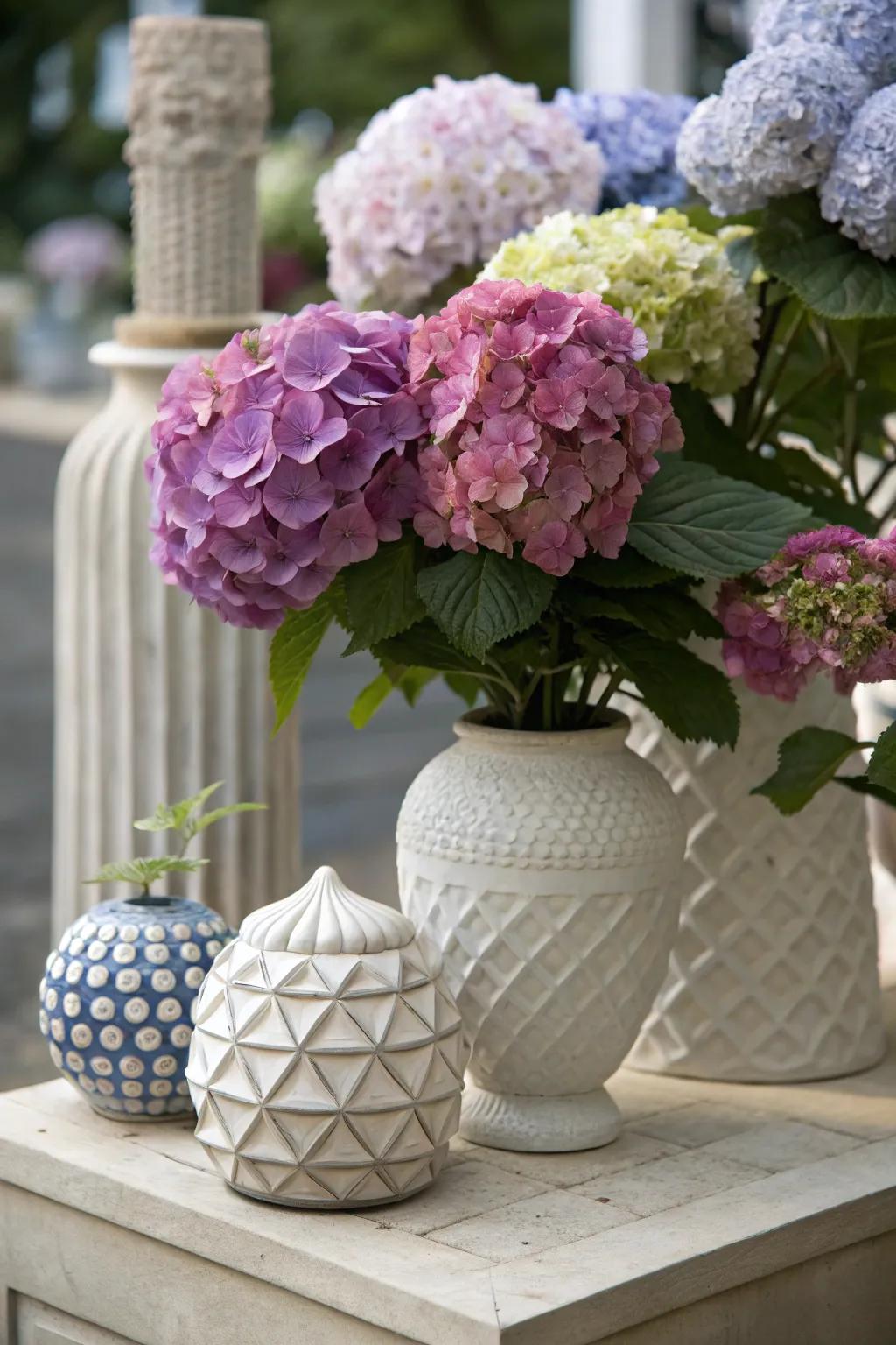 Artful installation of hydrangeas with sculpted elements.