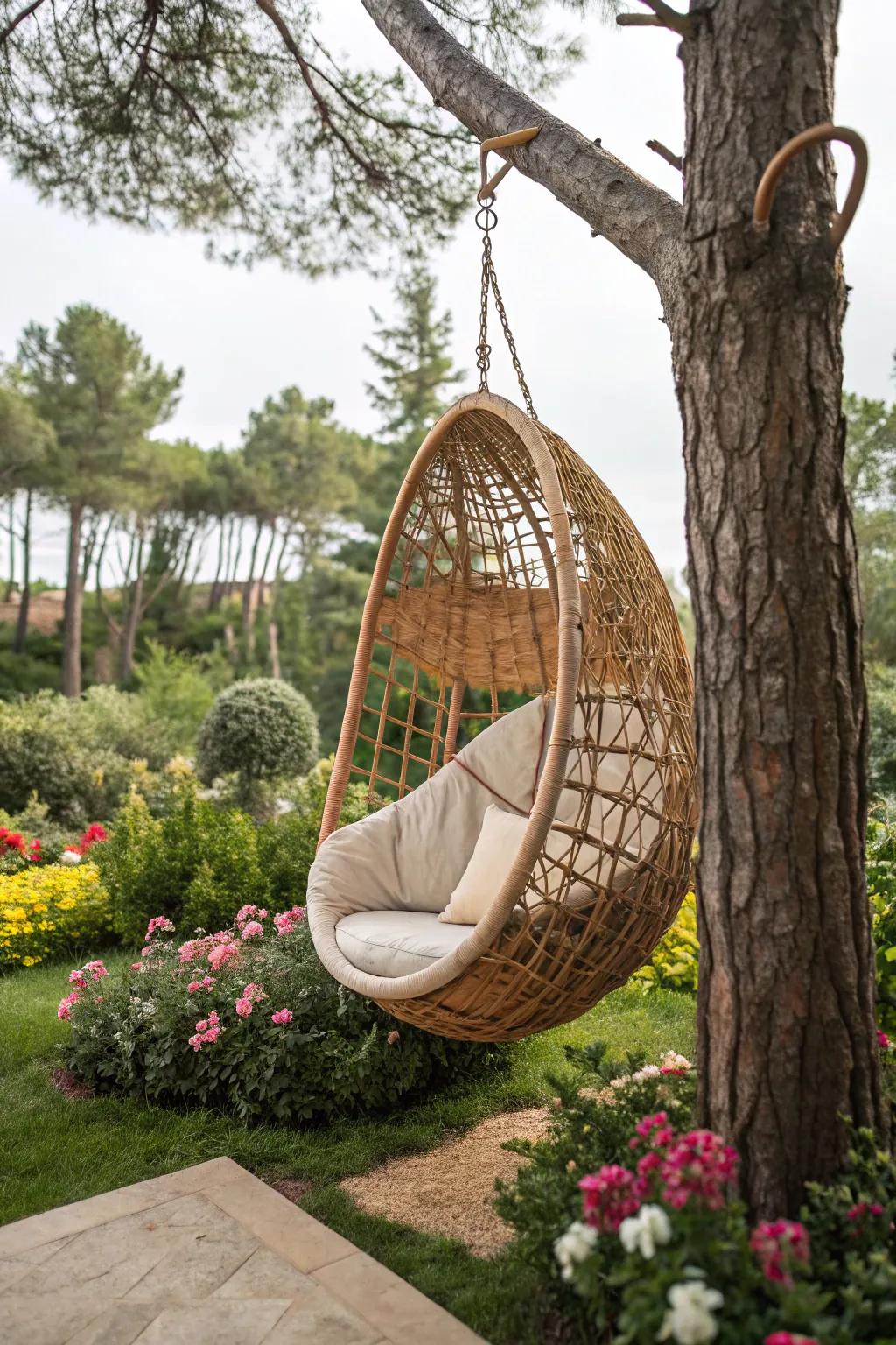 A rattan cocoon swing provides a snug garden retreat.