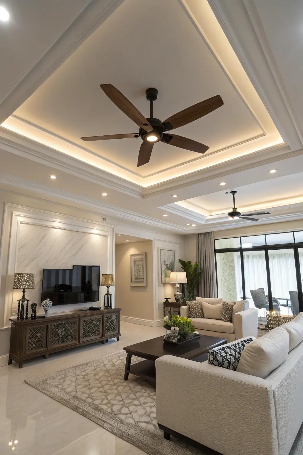 A modern living room features a sleek ceiling fan with lighting in the tray ceiling.