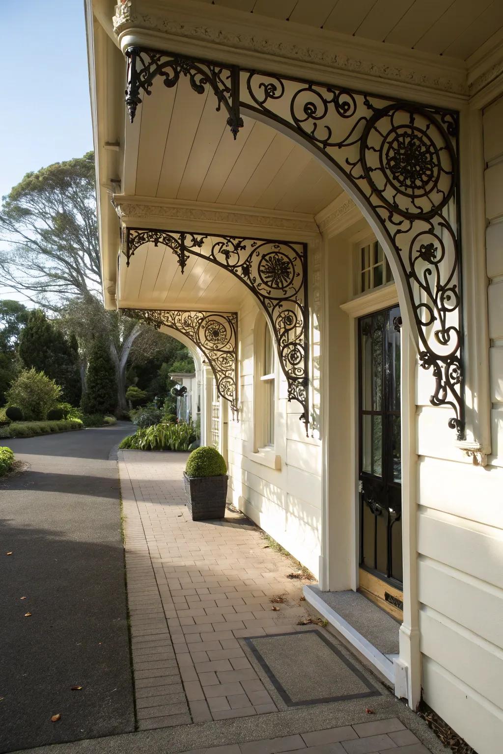An entrance with ornamental supports holding up a roof.