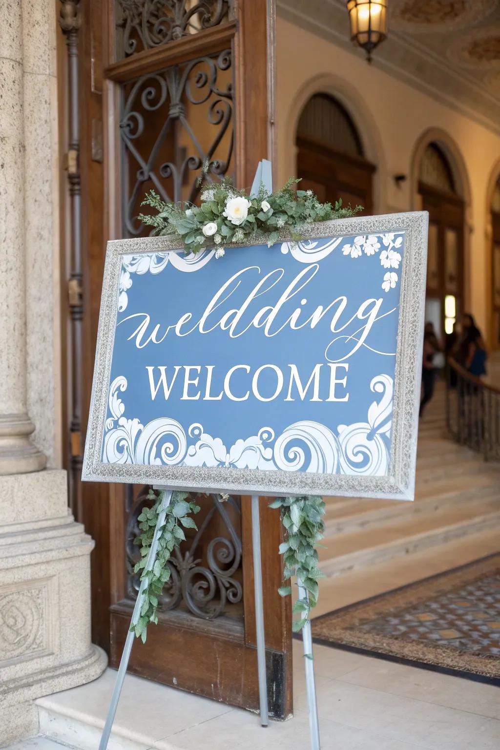 Stylish wedding signage featuring dusty blue accents, welcoming guests with elegance.