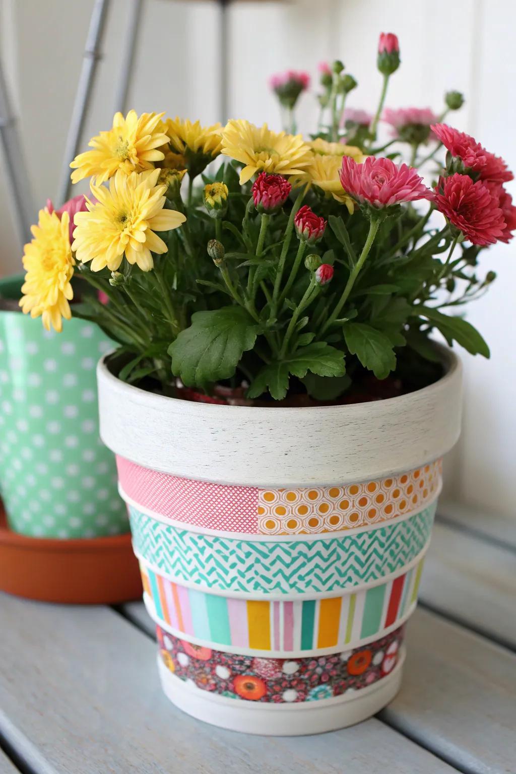 A flower pot enhanced with vibrant decorative covering designs.