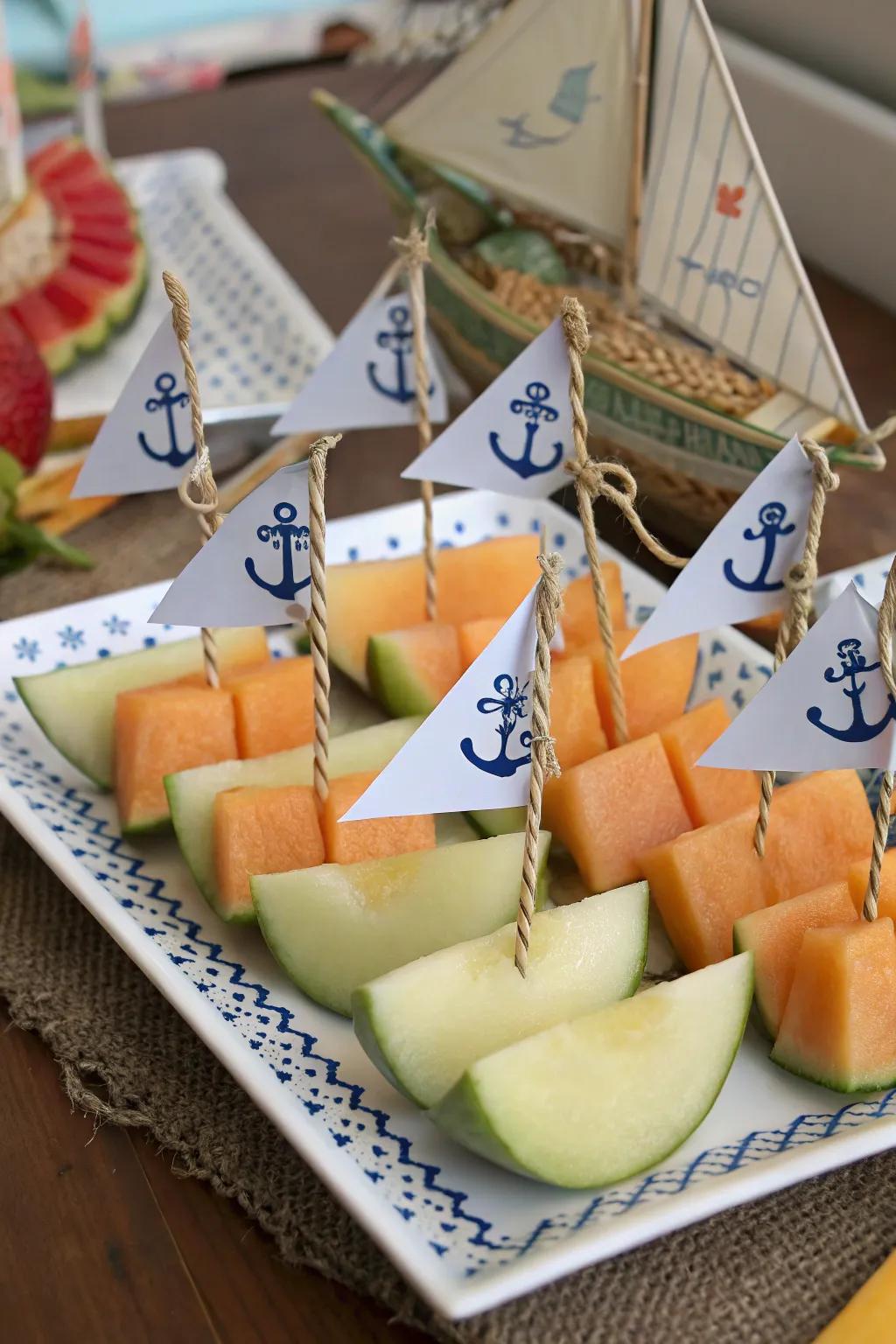 Fruit sailboats are a refreshing themed snack.