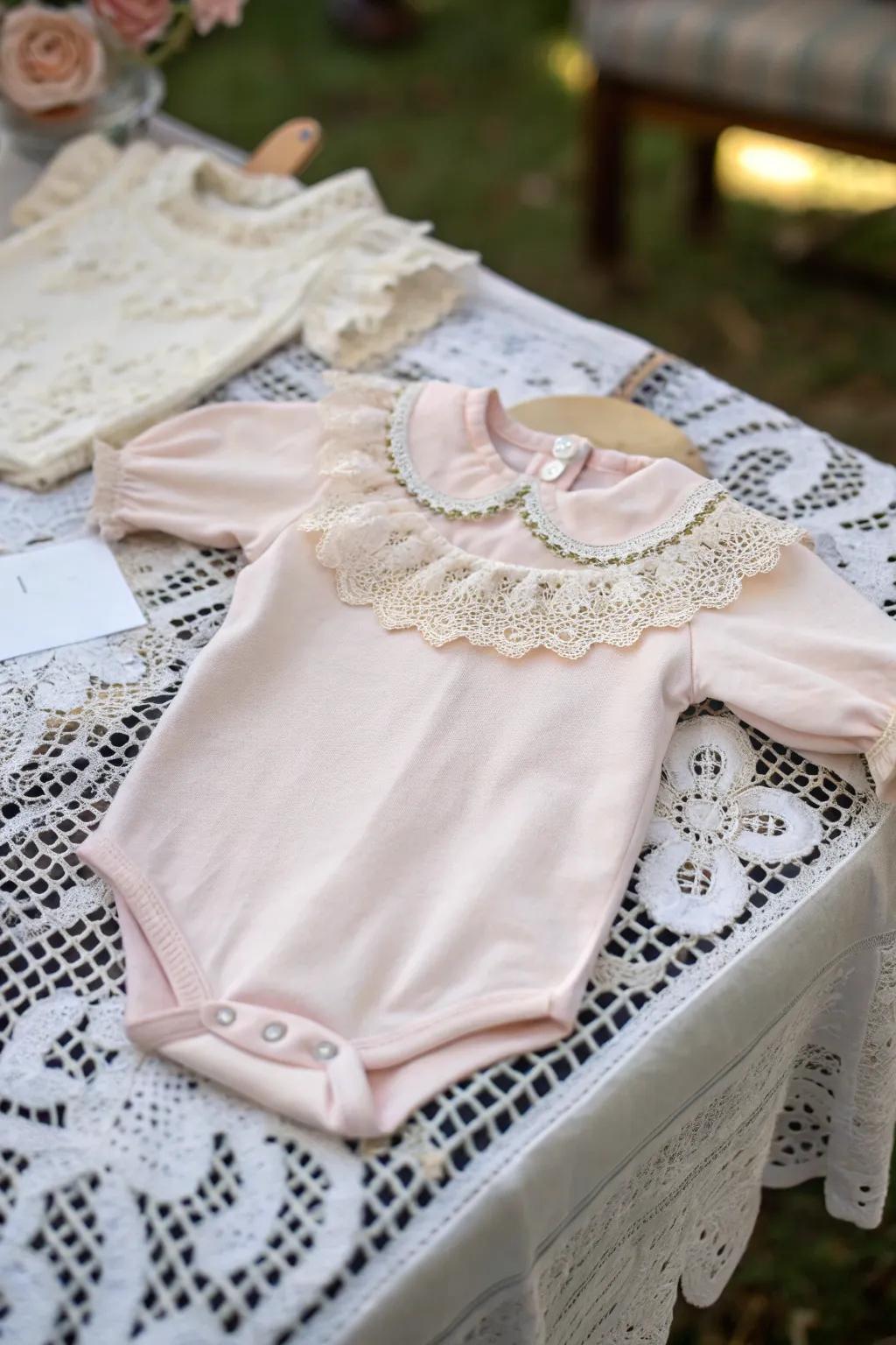 An elegant onesie showcasing vintage trim accents.