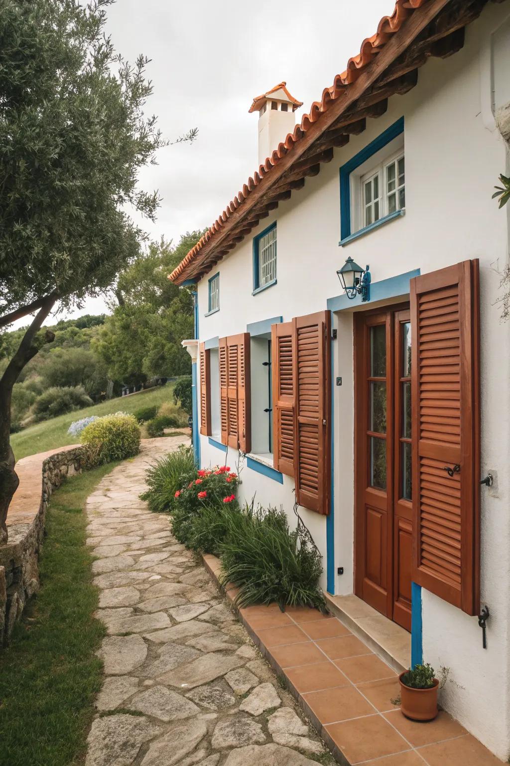Mediterranean-style house featuring terracotta awnings.