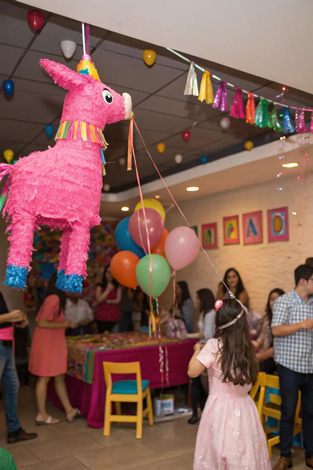 A hot pink piñata contributes playful fun to the festivities.
