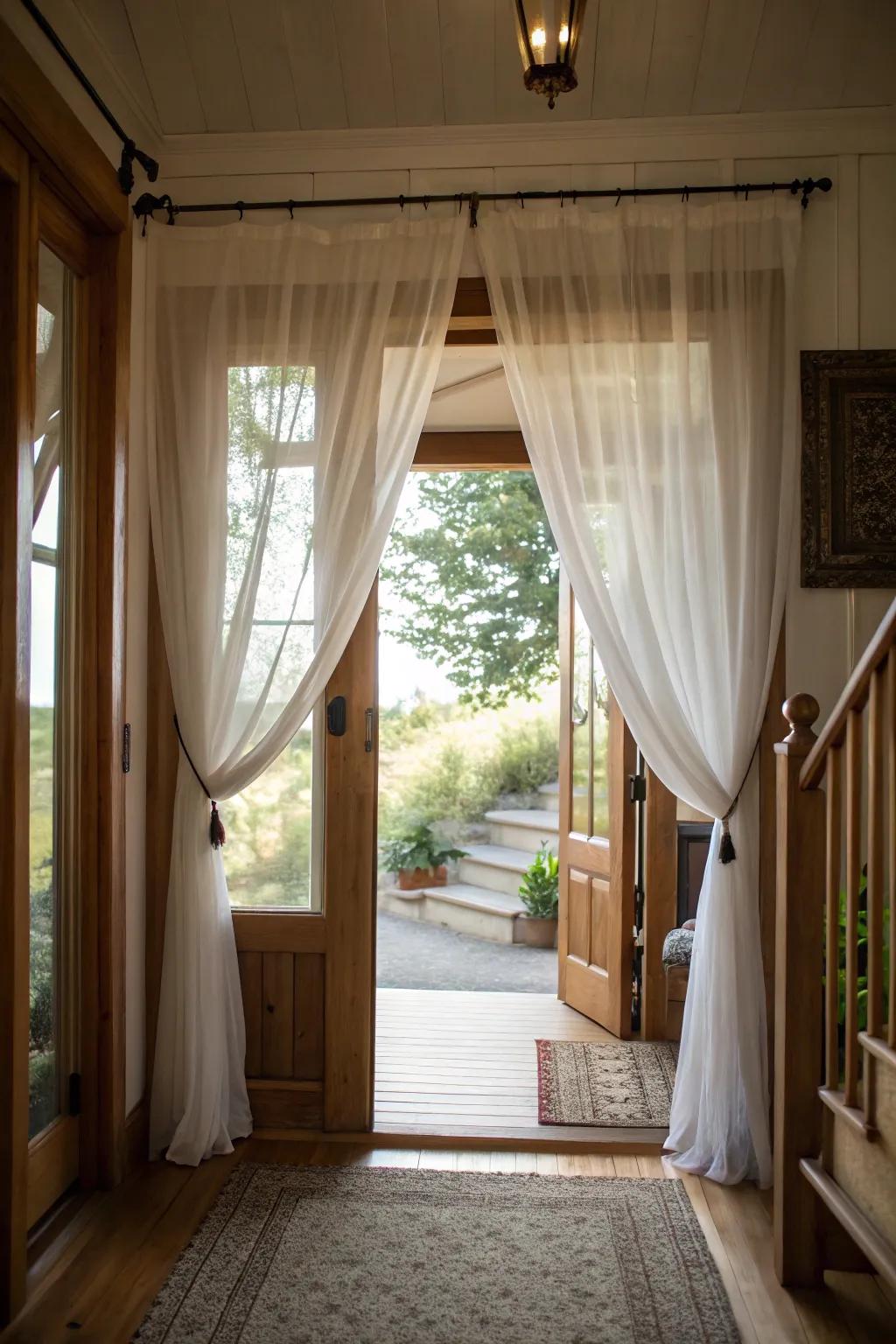 The entryway feels bright and open because sheer curtains let in the most natural light.