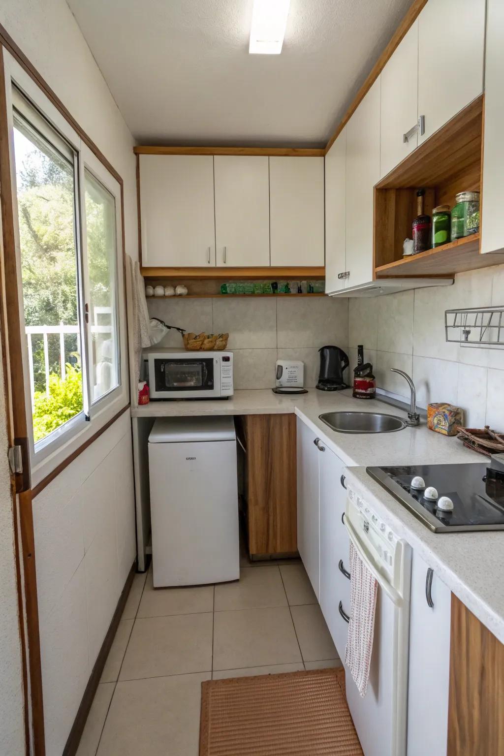 A small kitchen layout with appliances that save space in a small house.