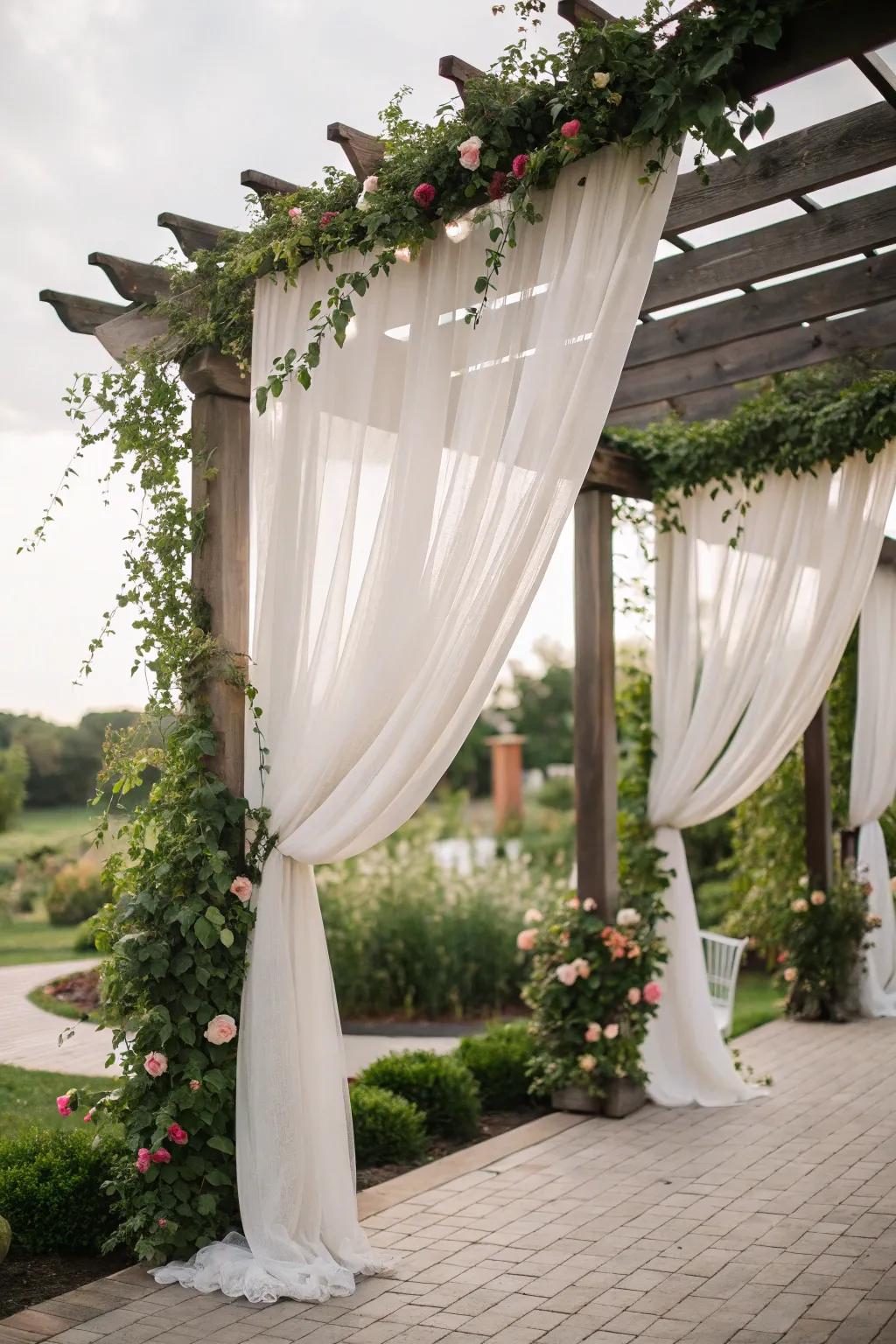 Curtains add romance and privacy to the pergola.