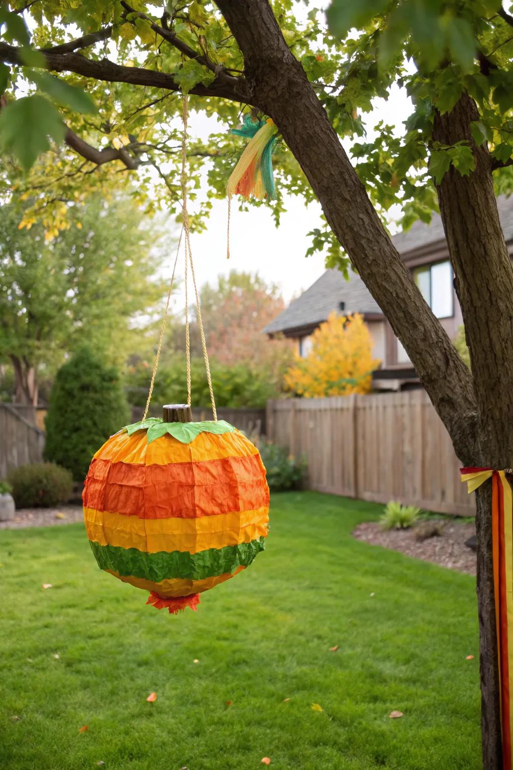 A pumpkin piñata contributes an element of surprise and enjoyment.