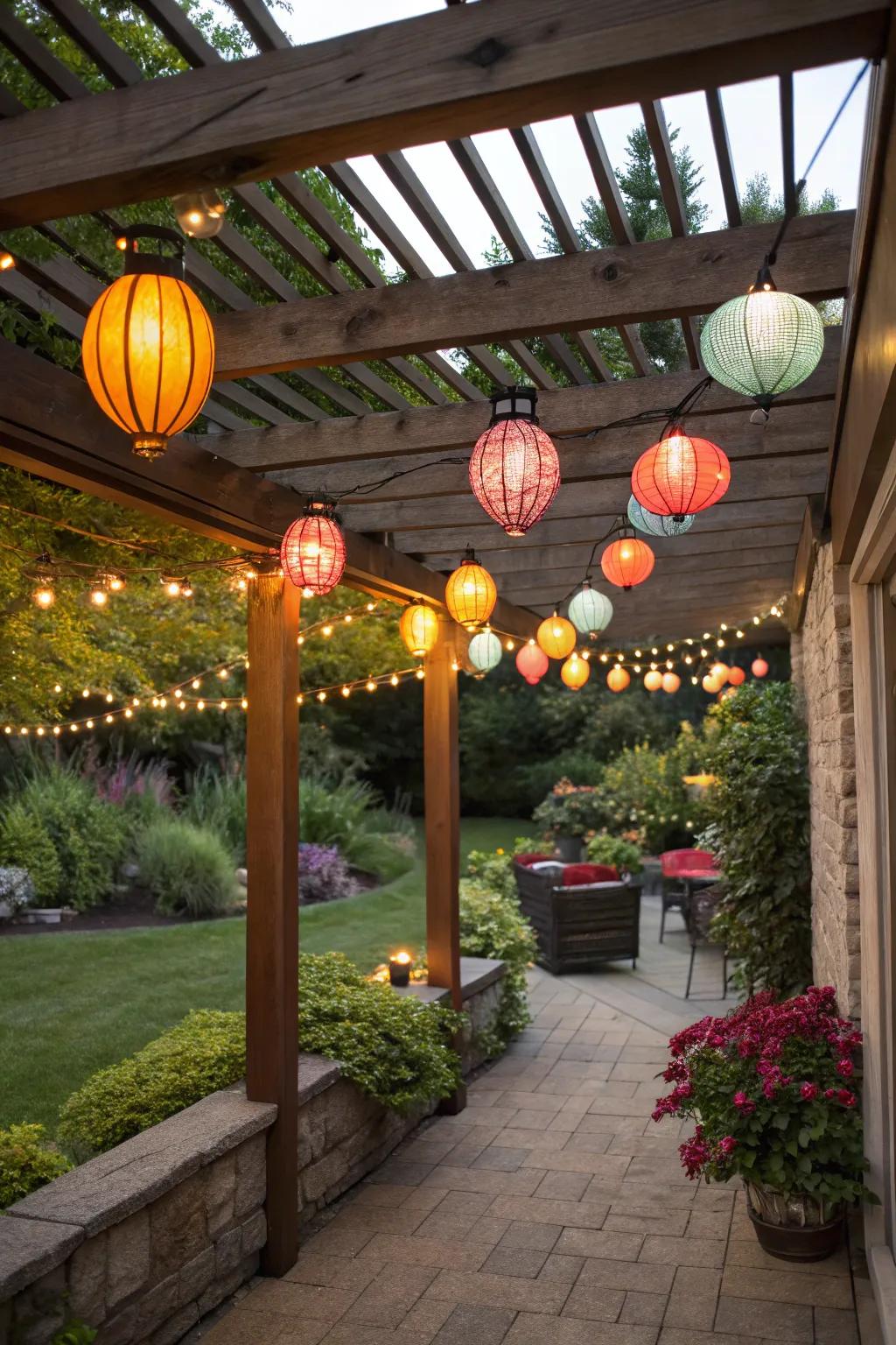 Multicolored lanterns infuse a celebratory vibe beneath a small pergola.