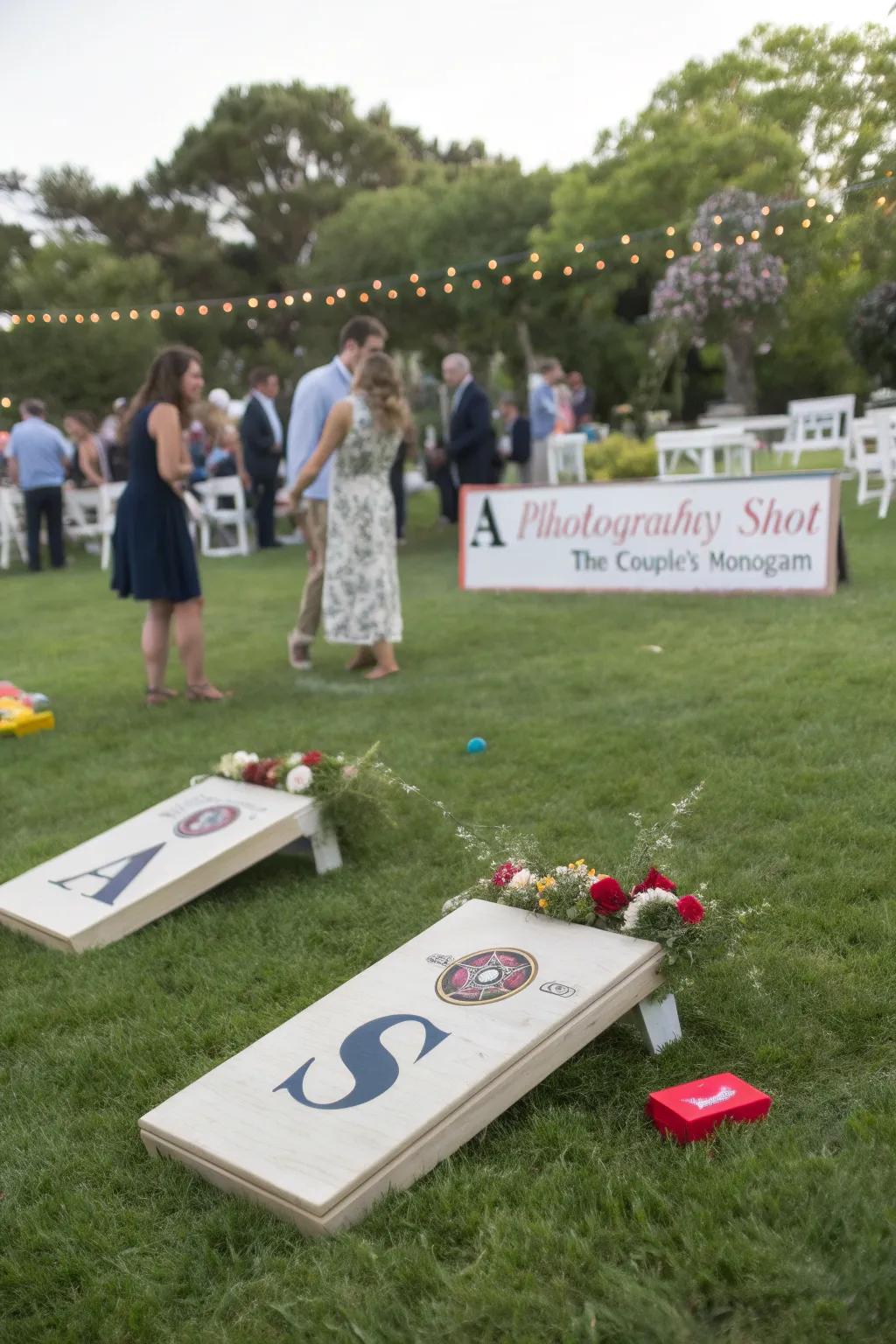 Custom lawn games at a wedding, featuring the couple's monogram and themed colors.