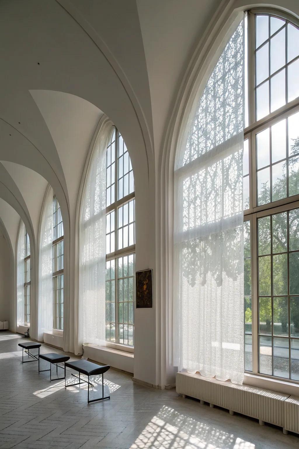 Modern minimalist space with translucent screens on arched windows.