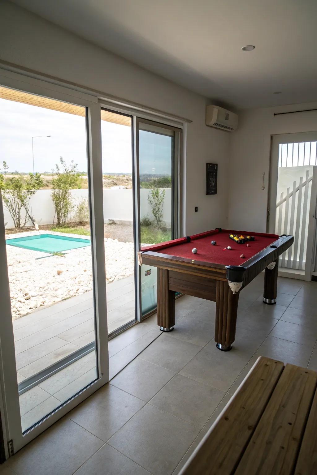 Sliding panels conserve space and amplify accessibility within a smaller billiard table room.