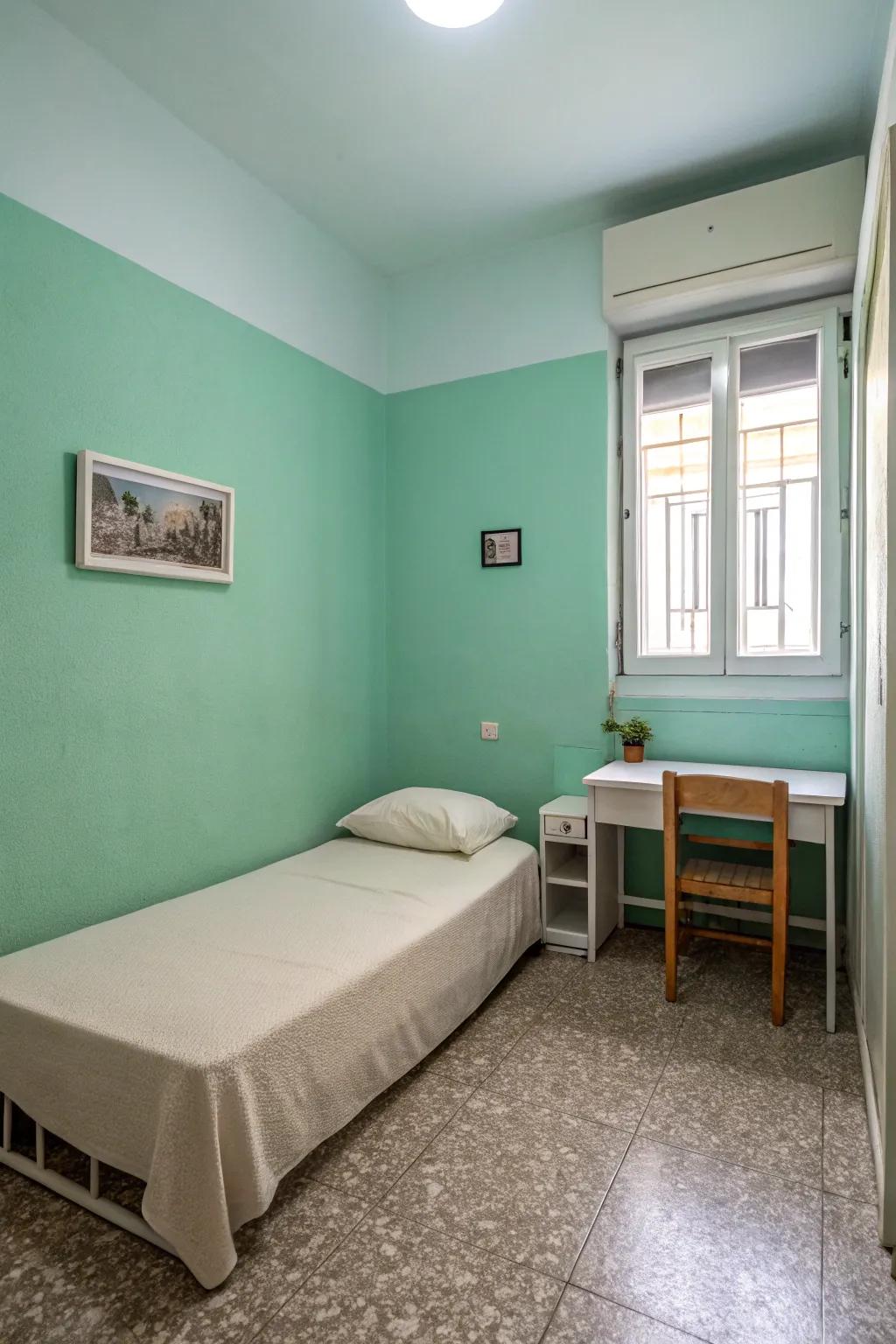 A minimalist haven exhibits subtle seafoam green walls.