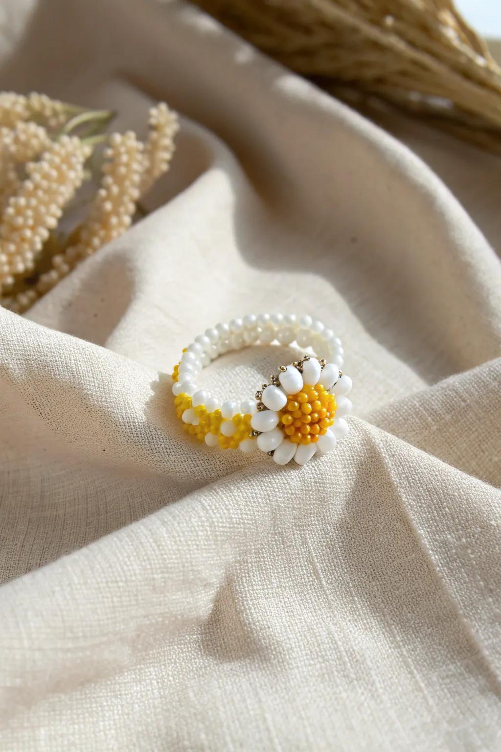 Embrace the essence of springtime with this delightful blossom-themed beaded ring, ideal for giving a hint of sunshine to any day.